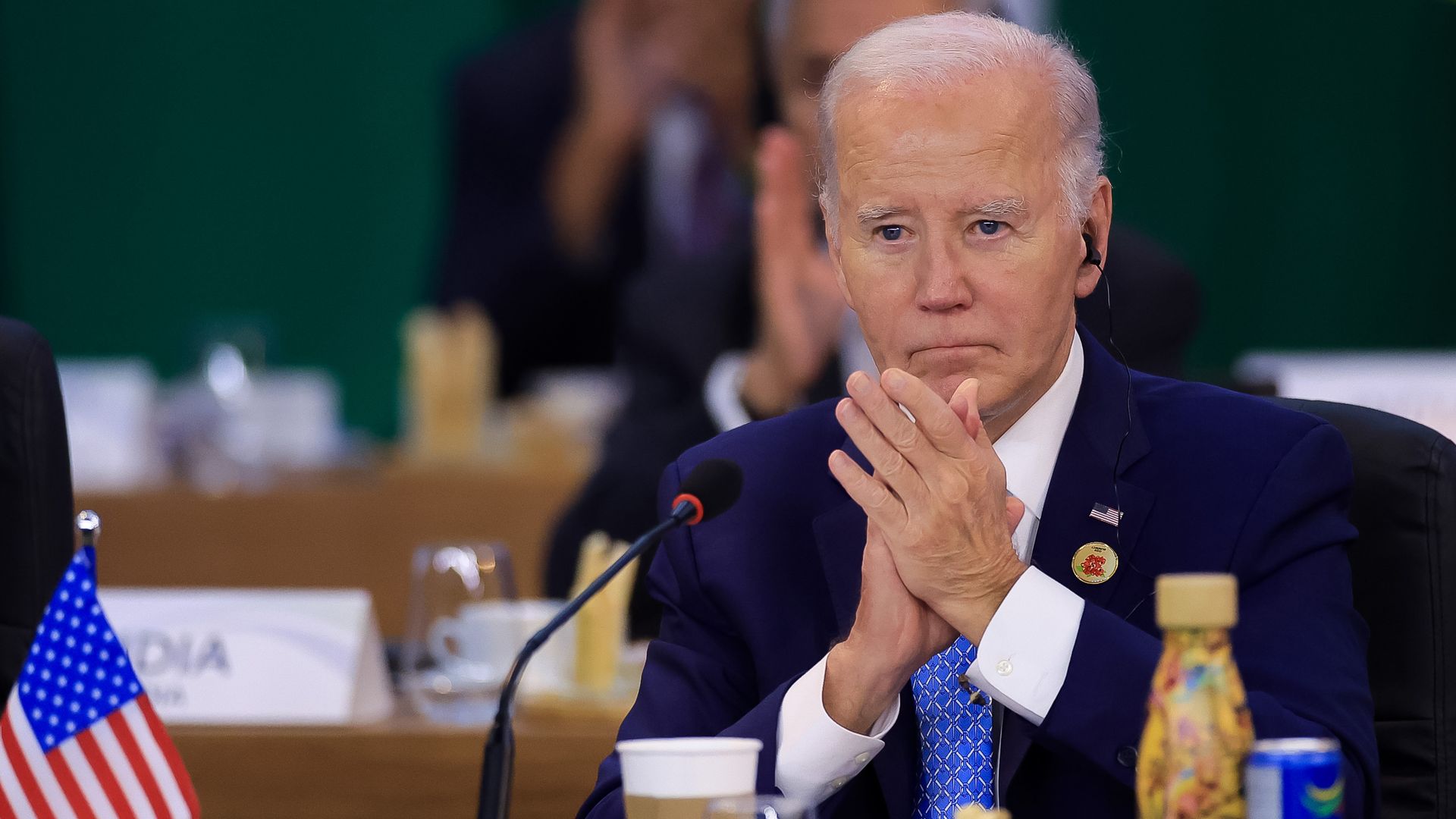 President Biden claps while looking ahead during a G20 summit meeting in Brazil