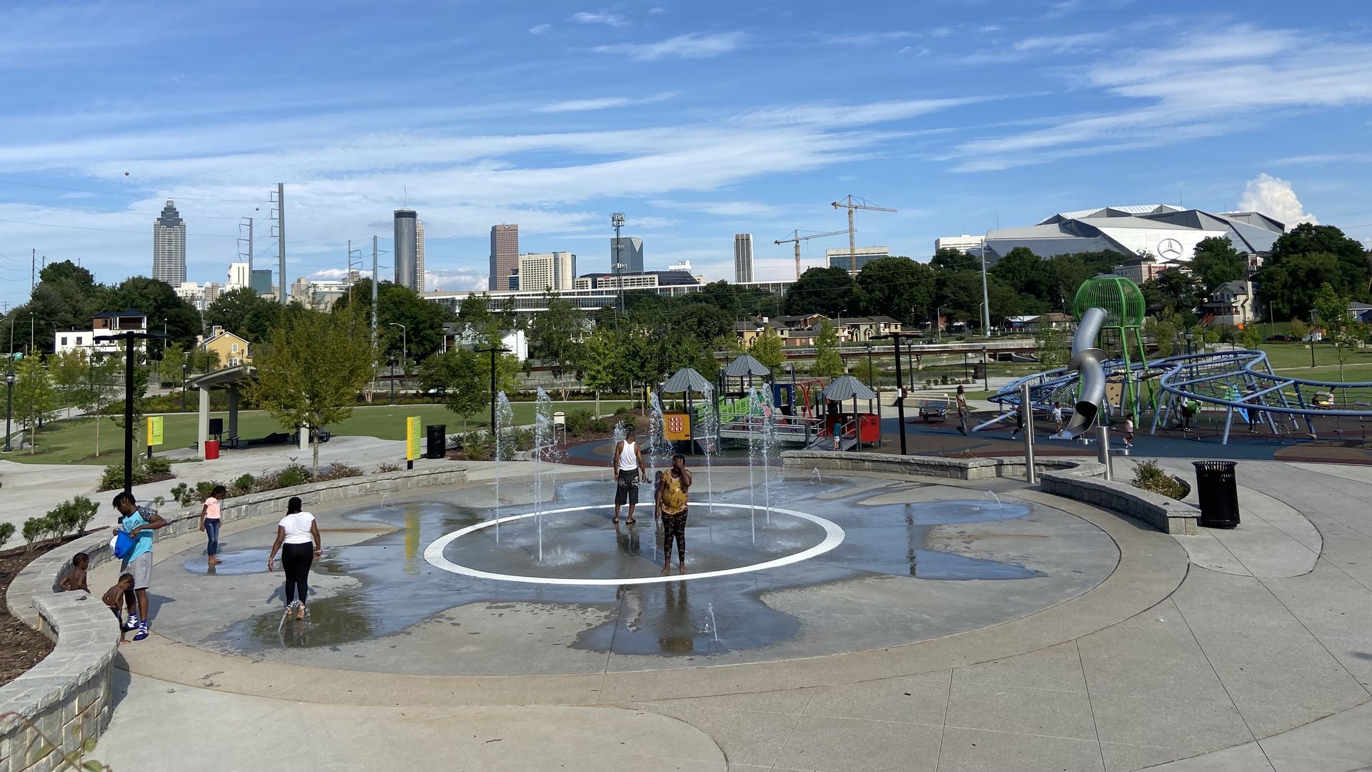 Children enjoying the splash pad at Cook Park in Vine City. 
