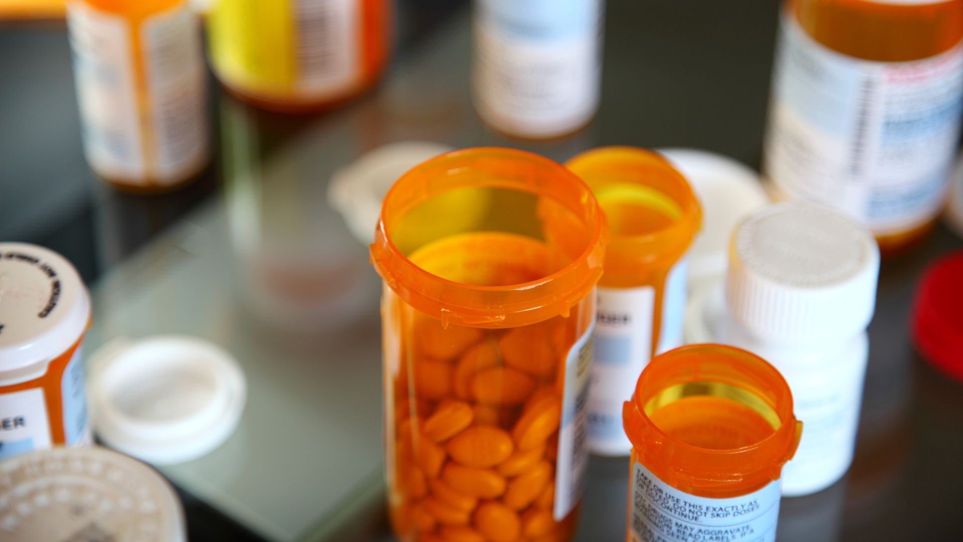 Variety of open pill bottles
