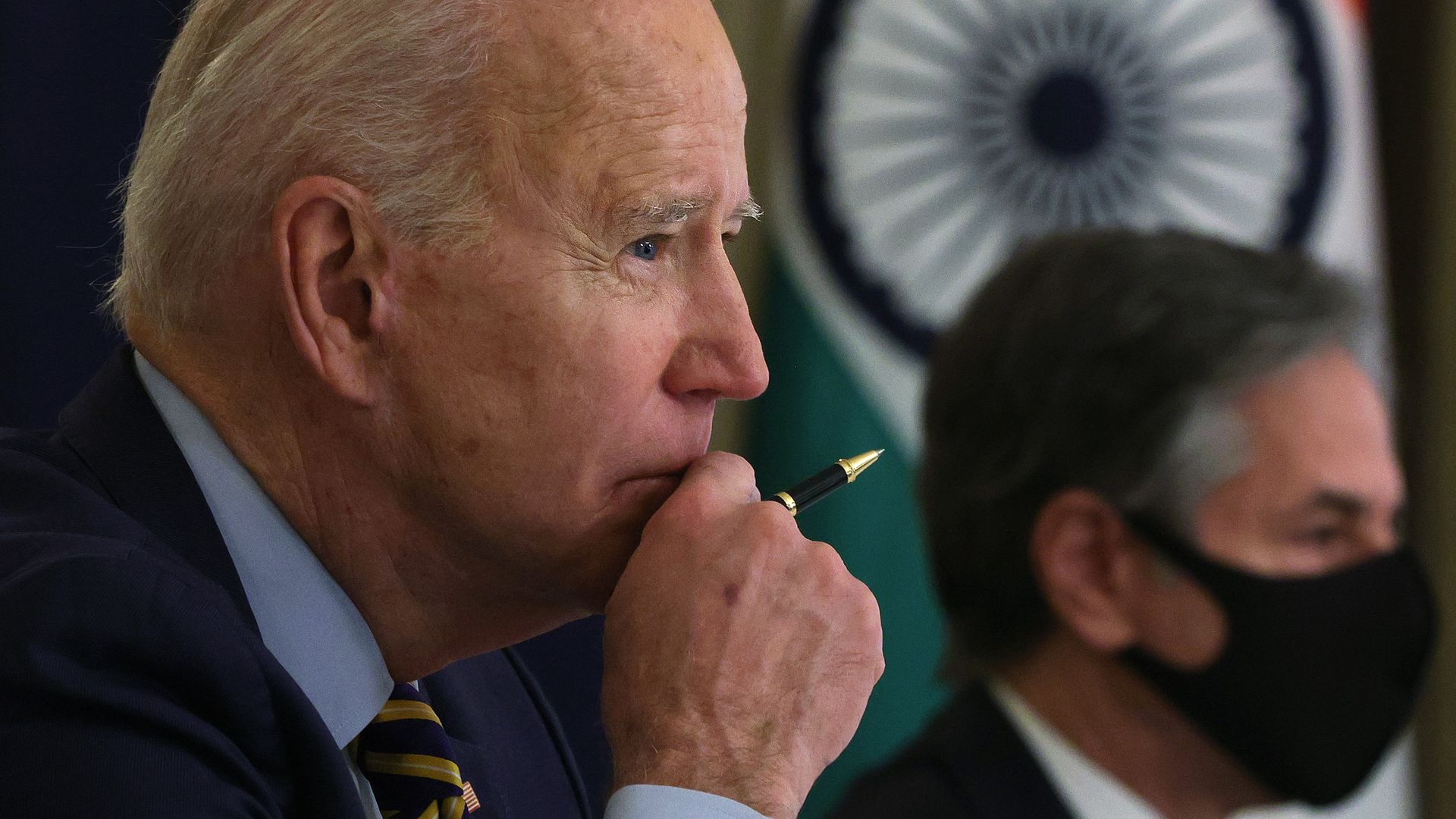 U.S. President Joe Biden (L) and U.S. Secretary of State Anthony Blinken (R) participate in a virtual meeting with leaders of Quadrilateral Security Dialogue countries March 12, 2021 .