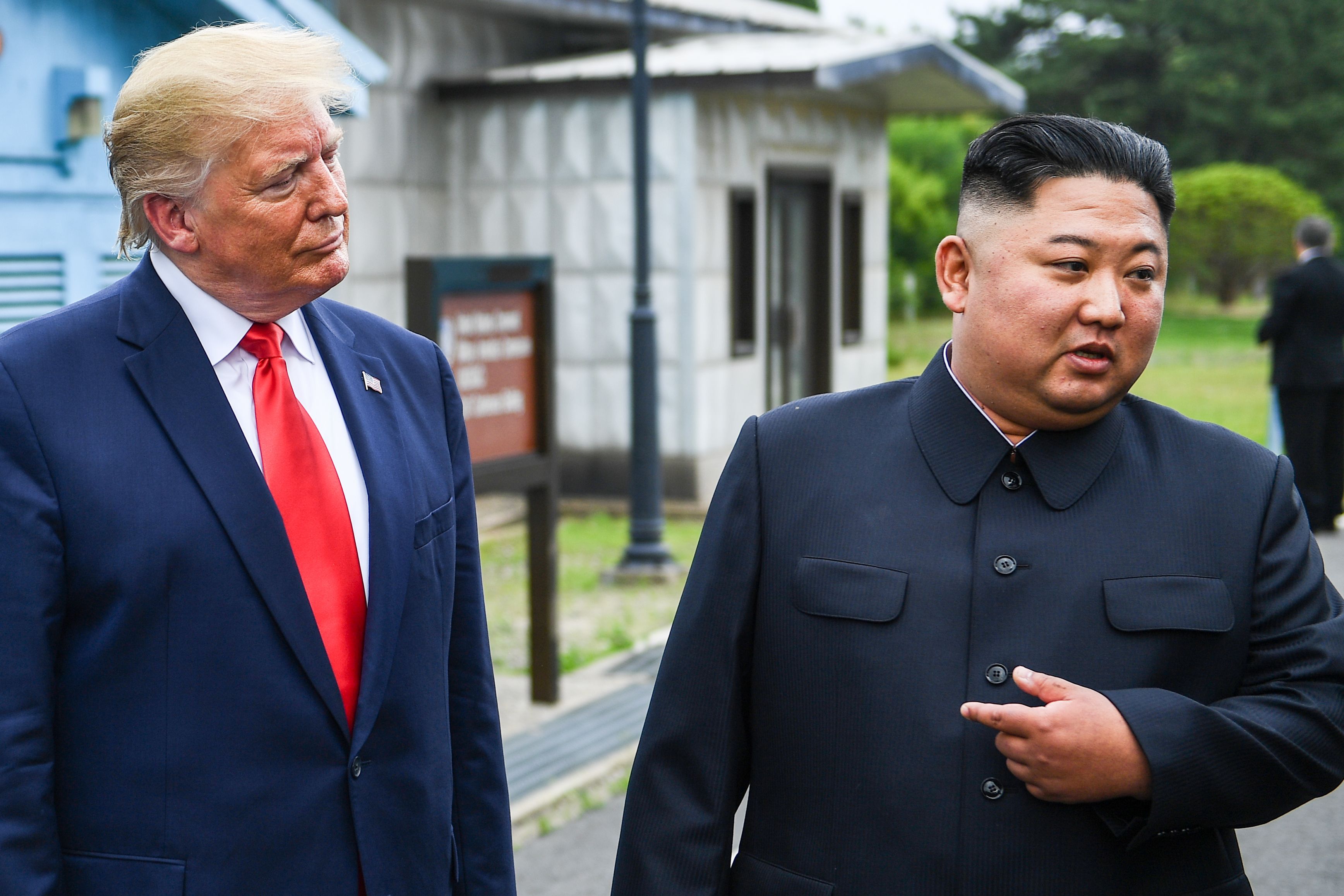 North Korea's leader Kim Jong Un speaks as he stands with US President Donald Trump south of the Military Demarcation Line.