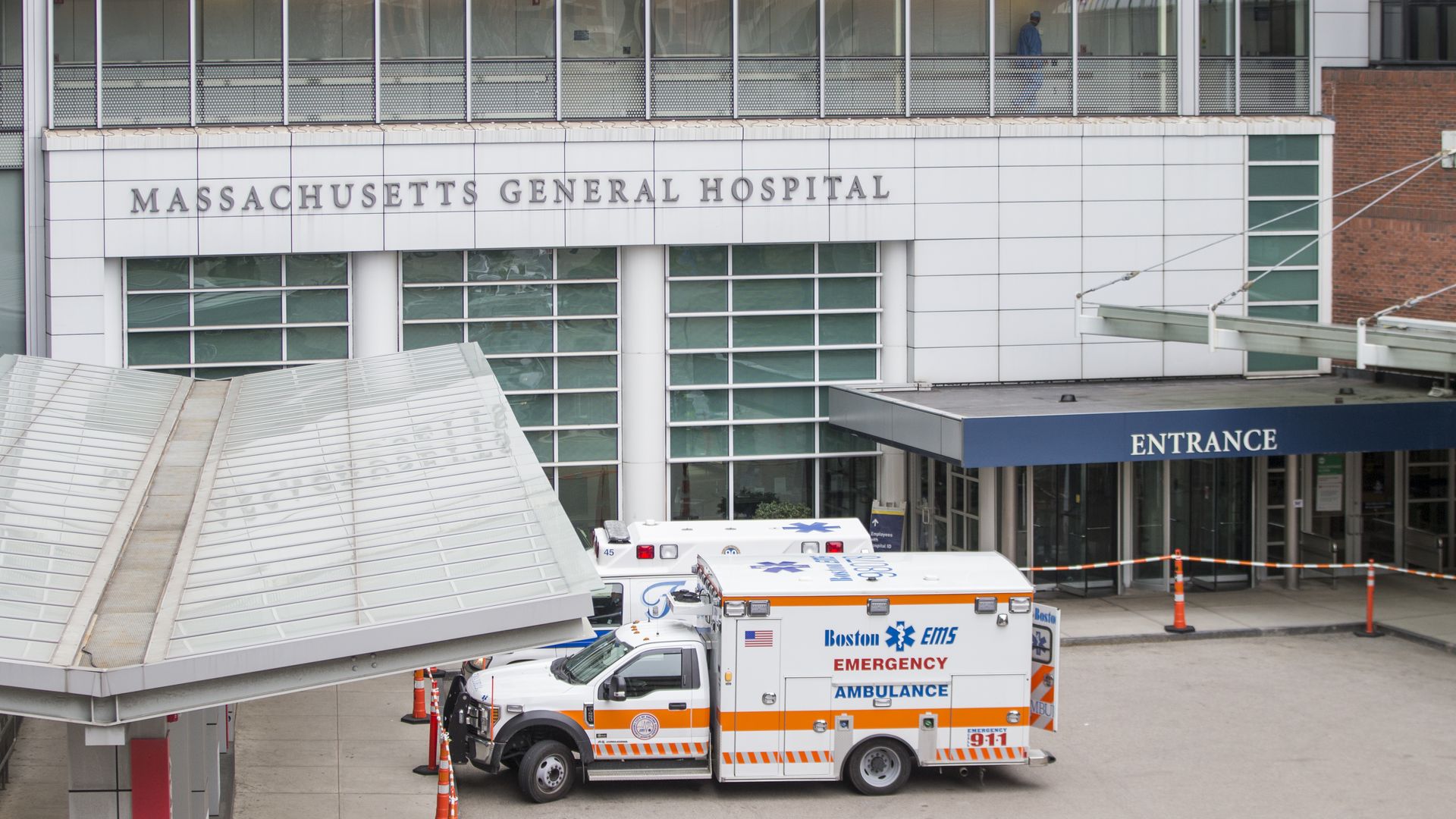 Ambulances parked outside Massachusetts General Hospital building.
