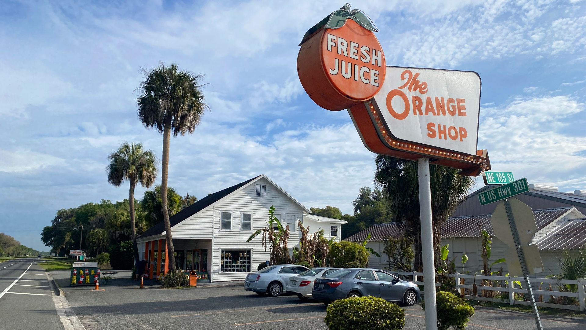 a sign for the orange shop