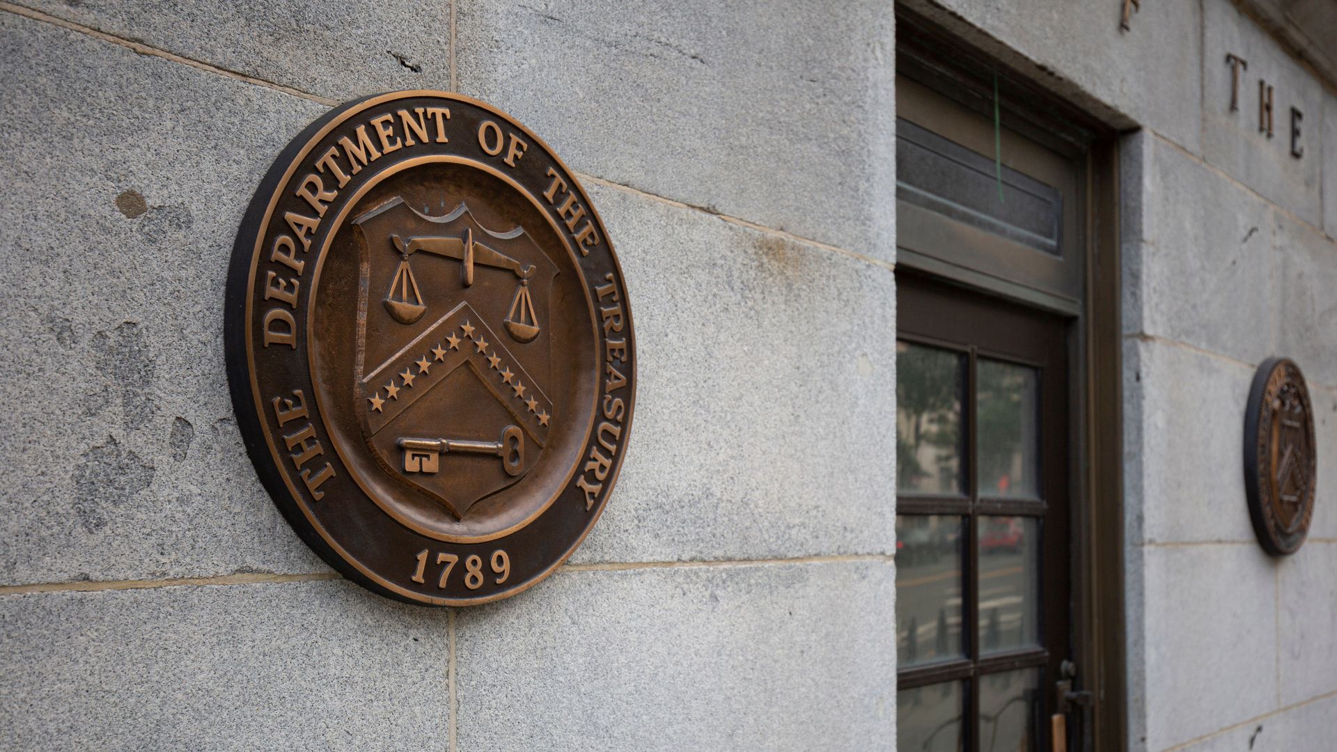 The Treasury Department logo outside of the federal building