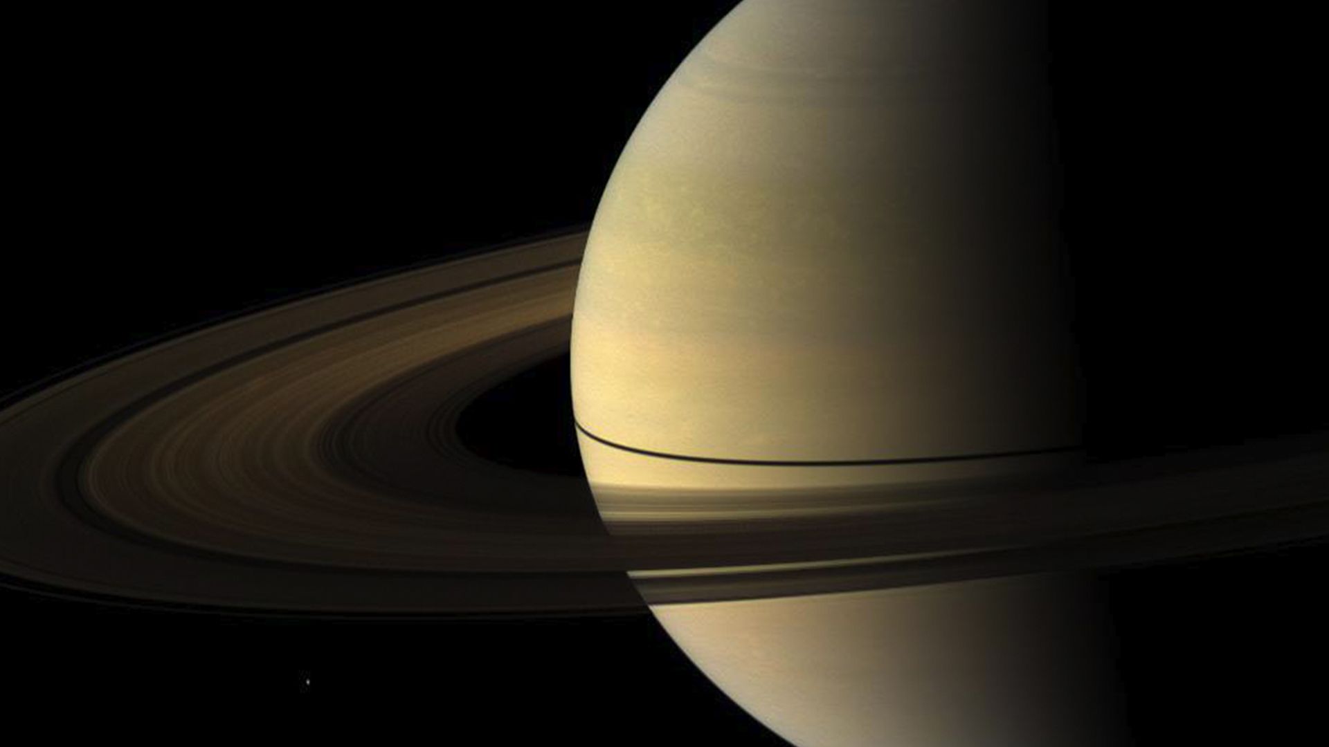A 2009 image from Cassini of Saturn's rings casting a narrow shadow on the planet. 