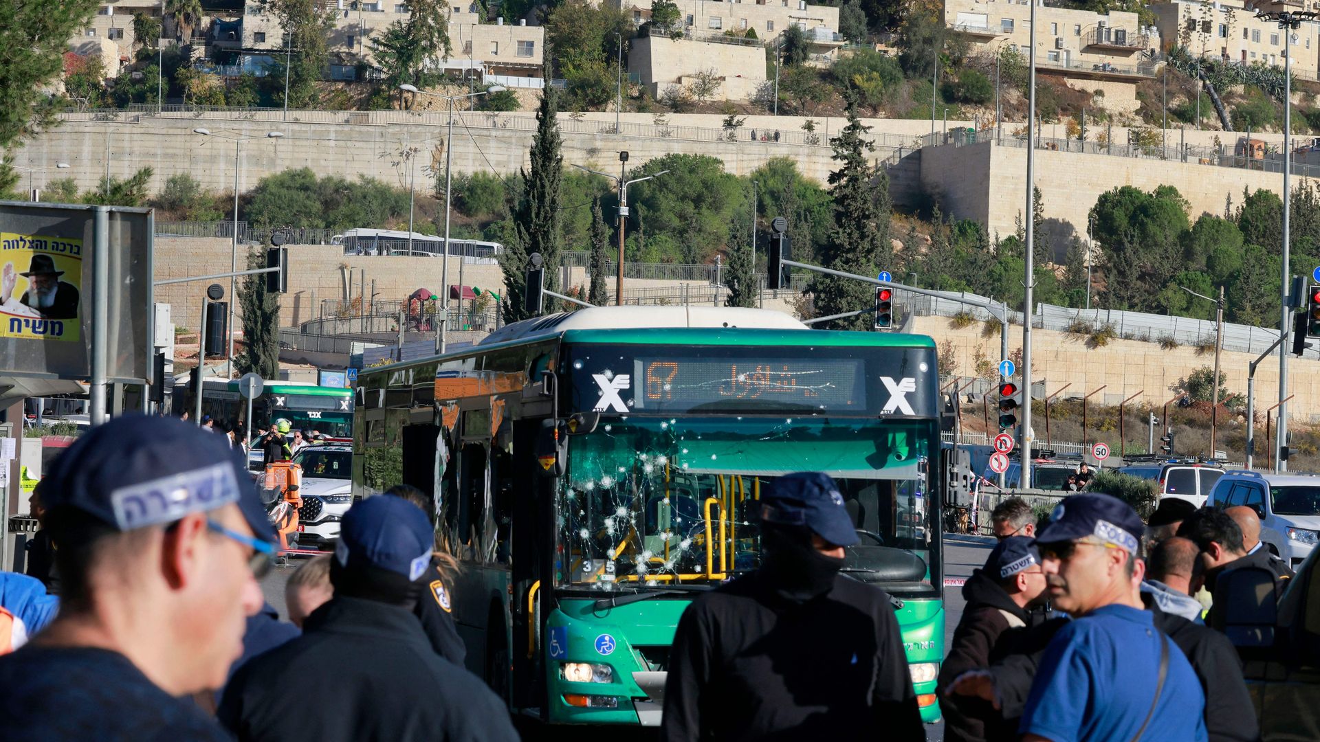 Israeli security forces gather at the scene of an explosion at a bus stop in Jerusalem on Wednesday.