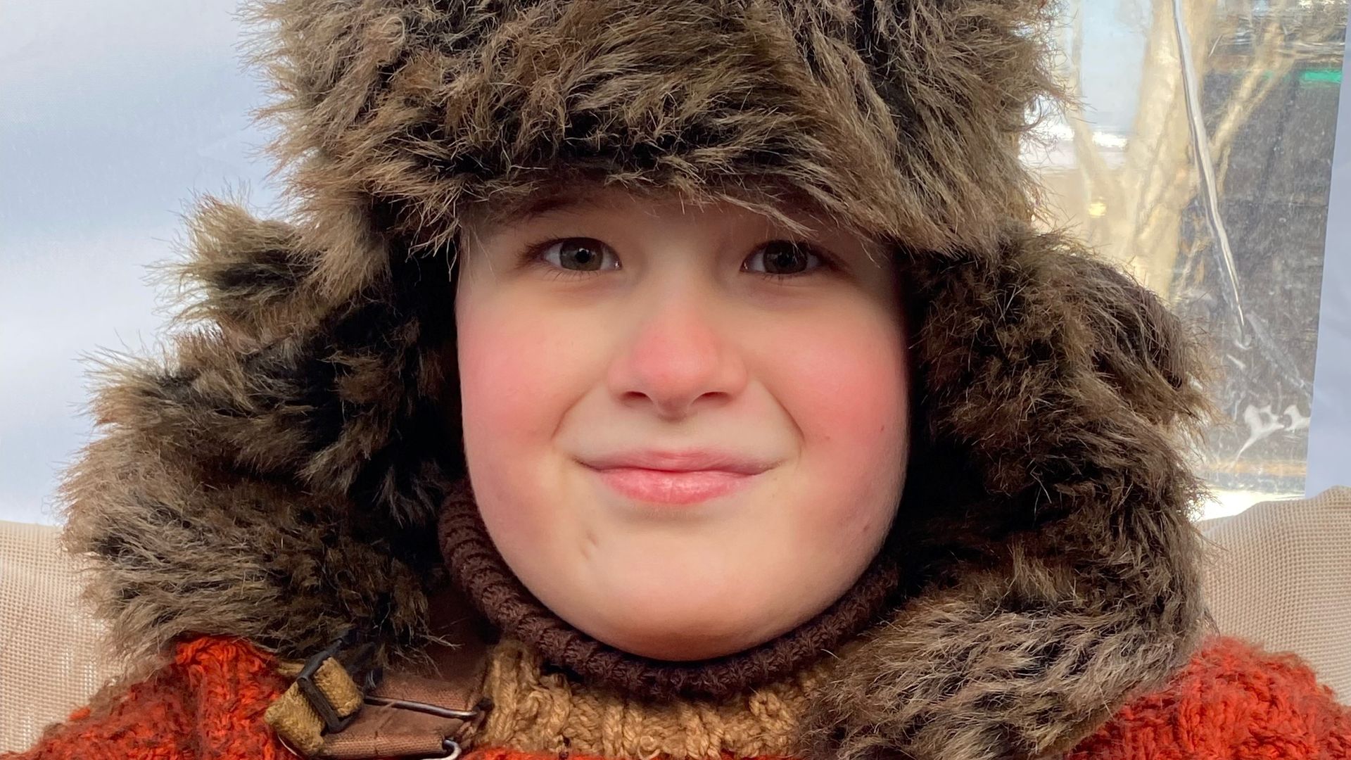 A kid dressed like he's in a 1970s snow storm