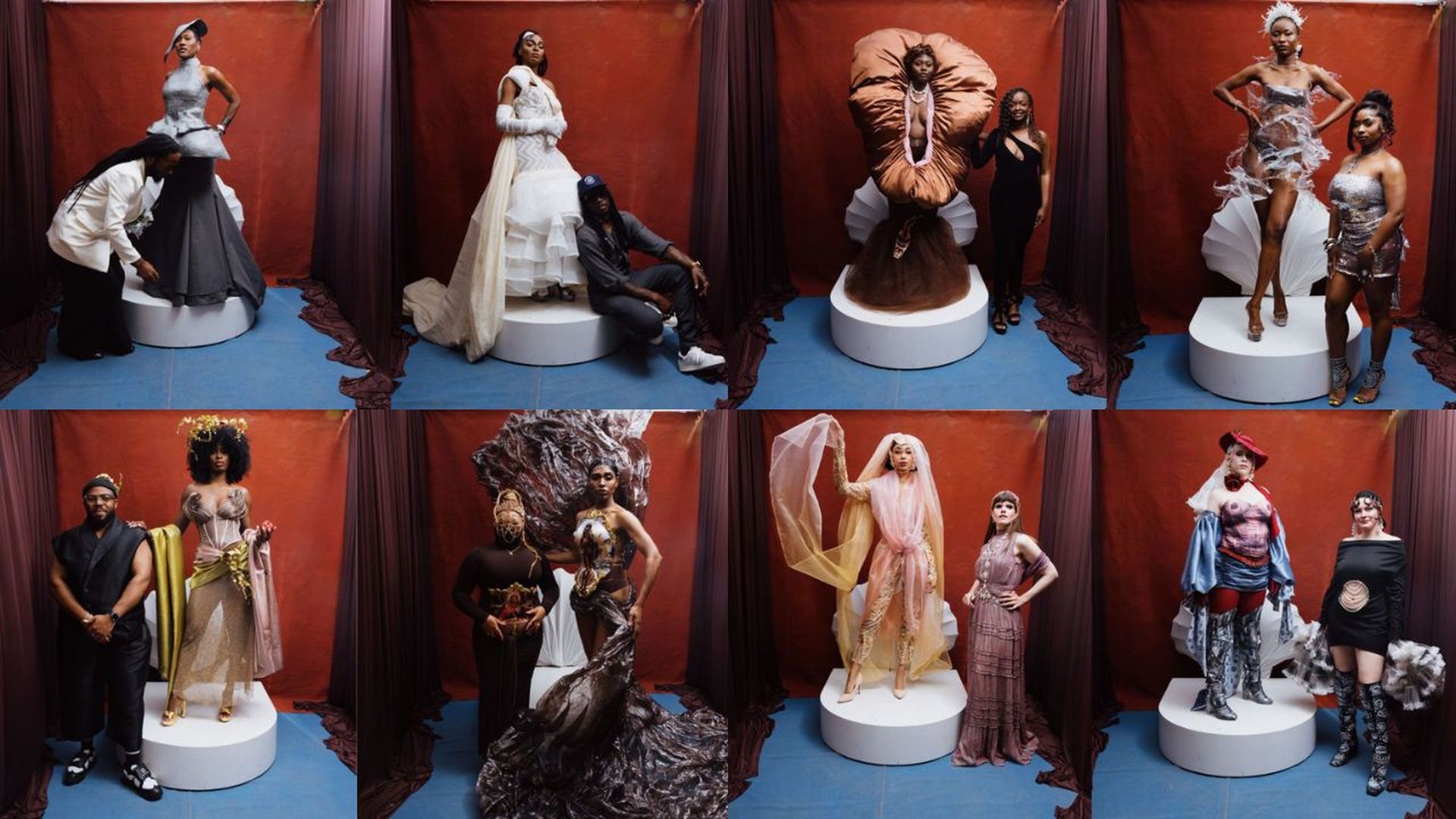 Eight models wear bold, sculptural fashion on white circular platforms, posed before red curtains and a blue floor. A diverse lineup showcases avant-garde gowns and dramatic silhouettes.