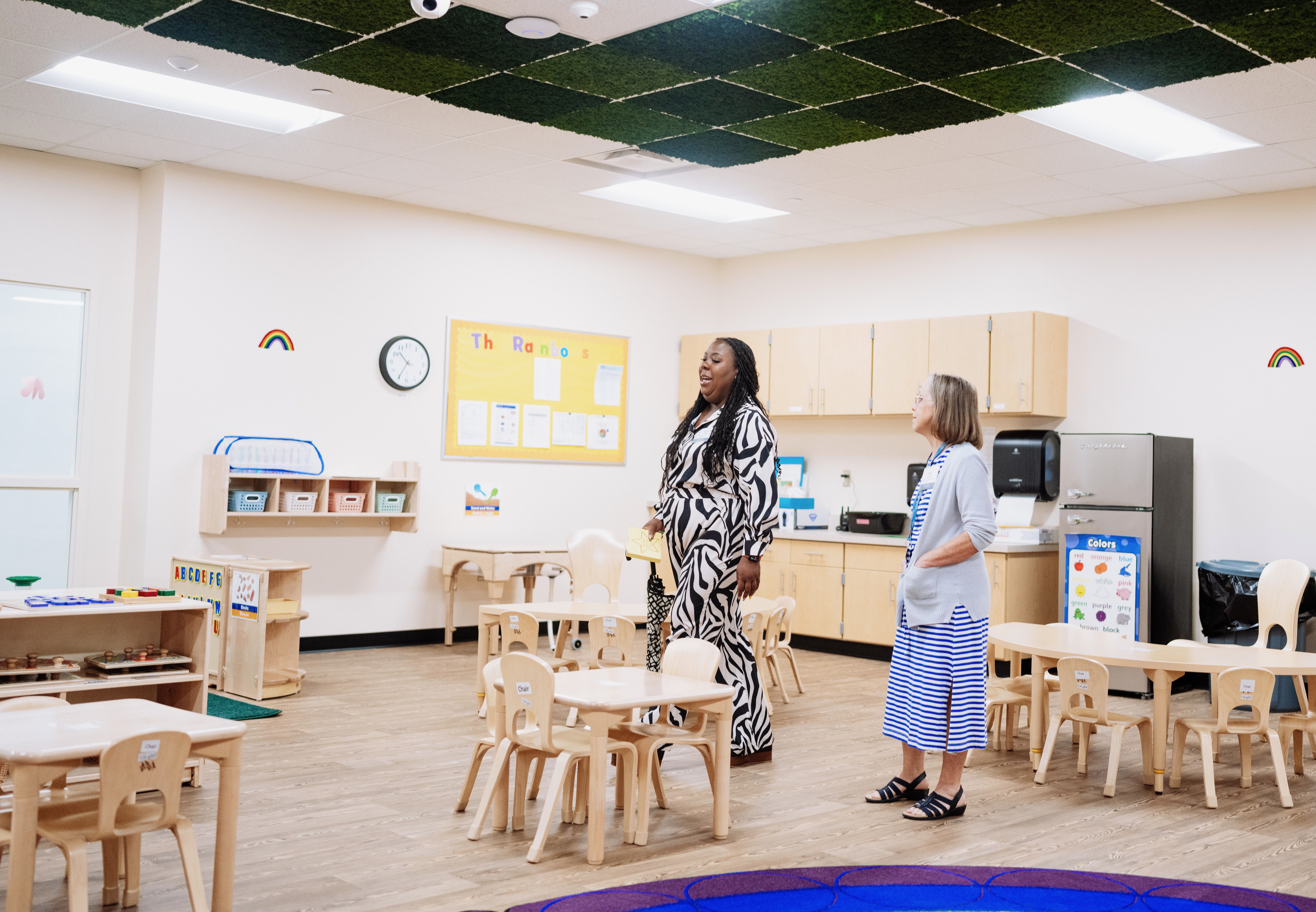 Two Columbus State staff members stand in a classroom at the college's new child care center