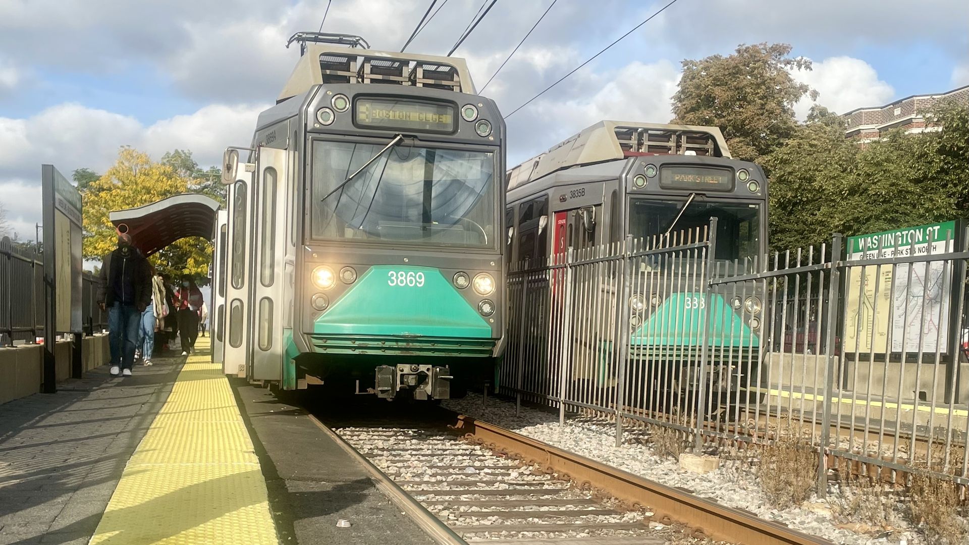 Two Green Line trains passing in opposite directions at the Washington Street stop on the B Line.
