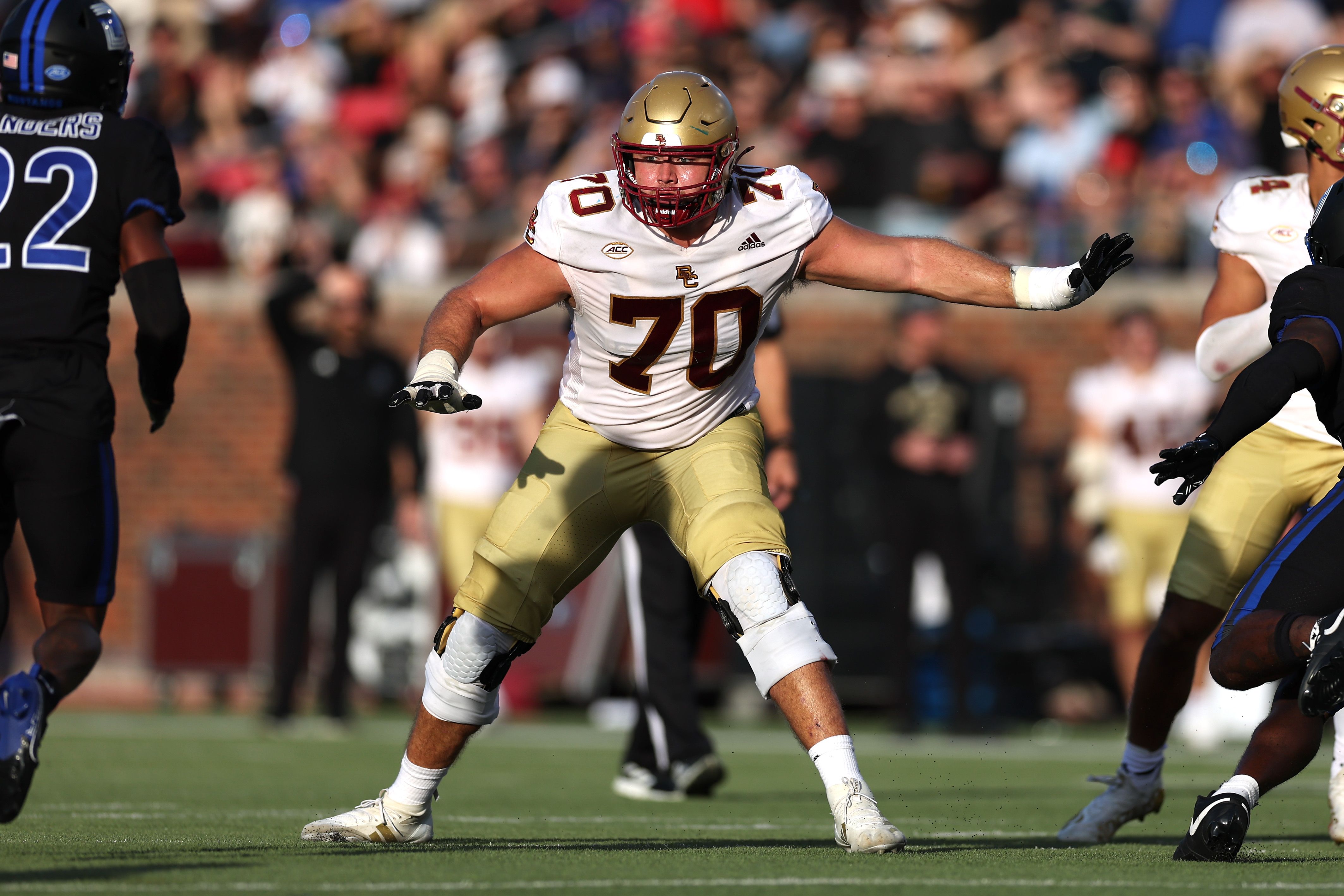 Photo of a football player on a field during a game. 