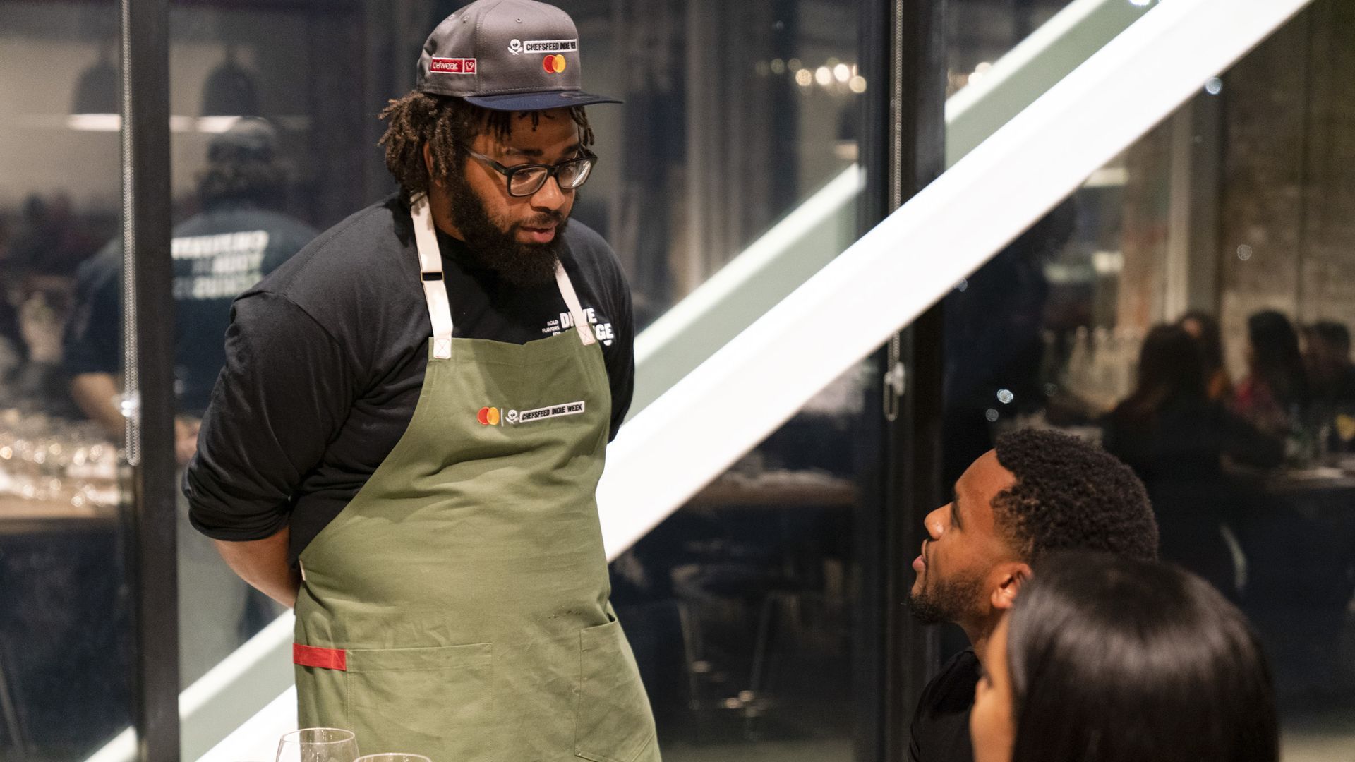 Chef Kurt Evans speaks to guest during one of his End Mass Incarceration dinners. 