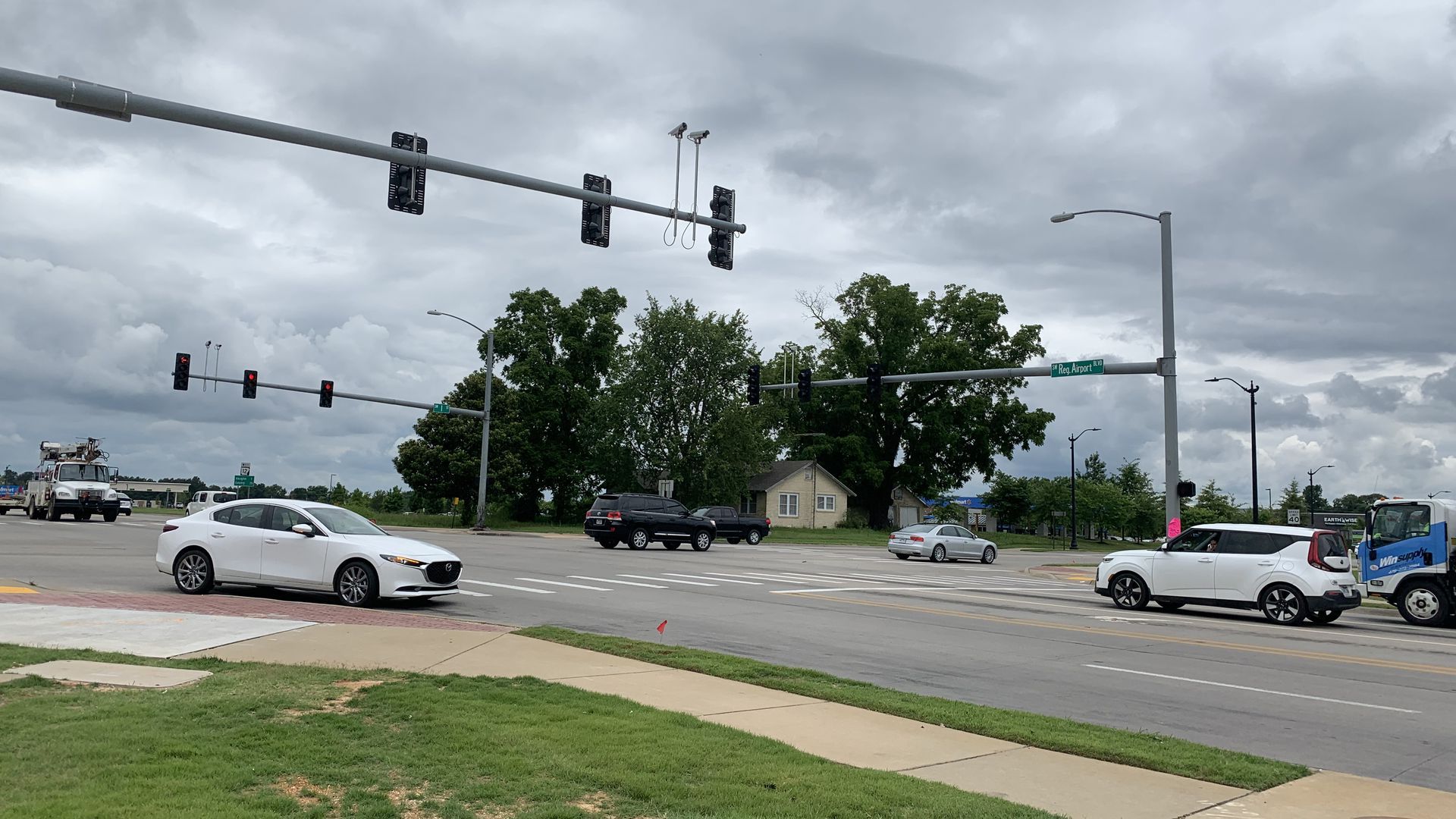 Cars drive through an intersection in Bentonville