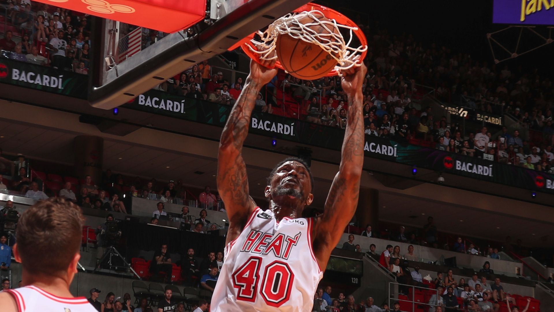 Miami Heat player Udonis Haslem dunks.