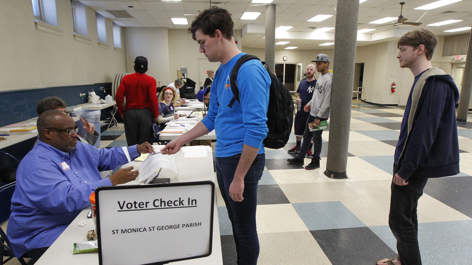 A voter signs in to vote in Ohio’s 2016 primary election. 
