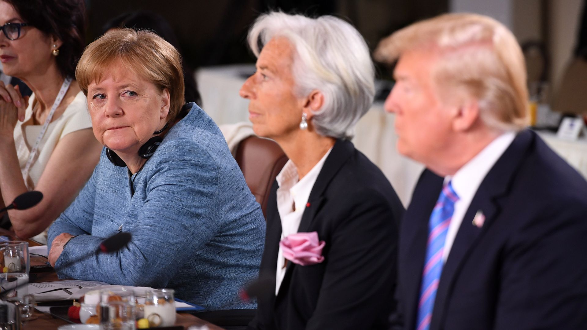 German Chancellor Angela Merkel looks towards President Donald Trump during a working breakfast at the G7 Summit on Friday in Quebec City, Canada. 