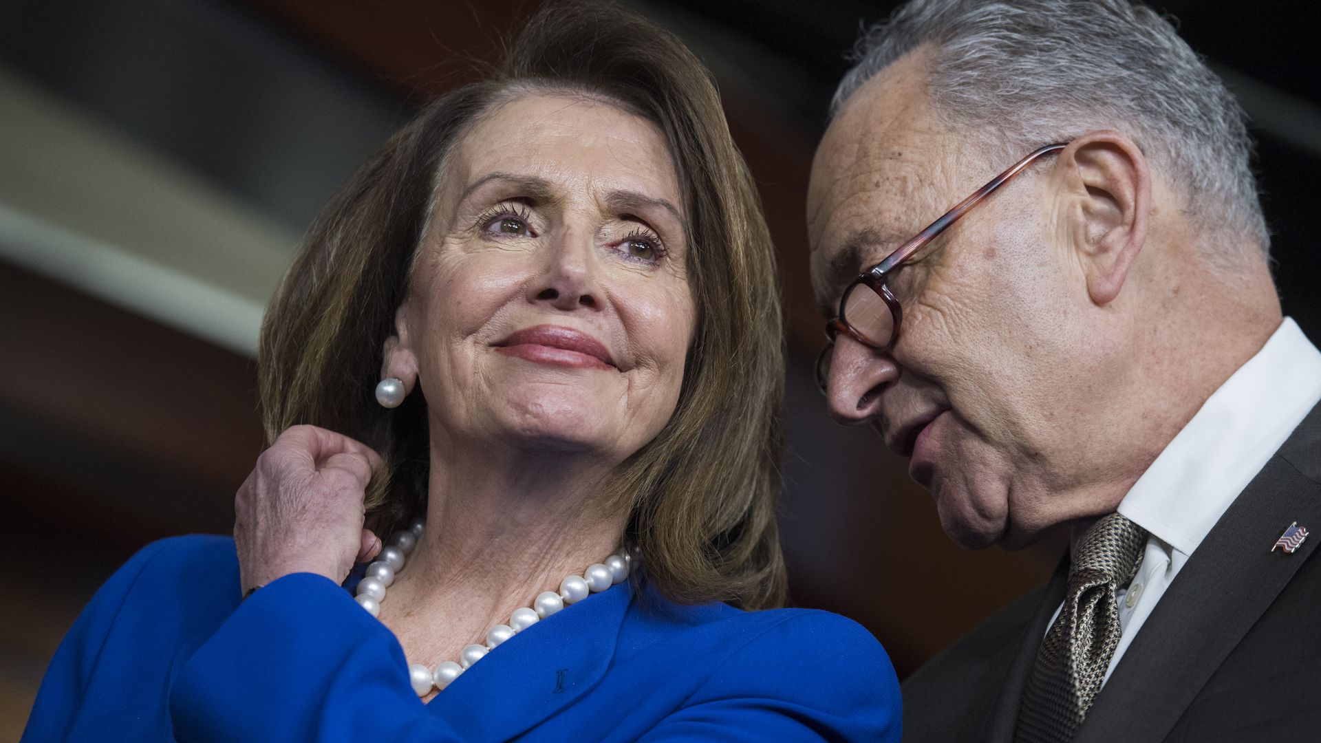 Nancy Pelosi and CHuck Shumer speak to each other