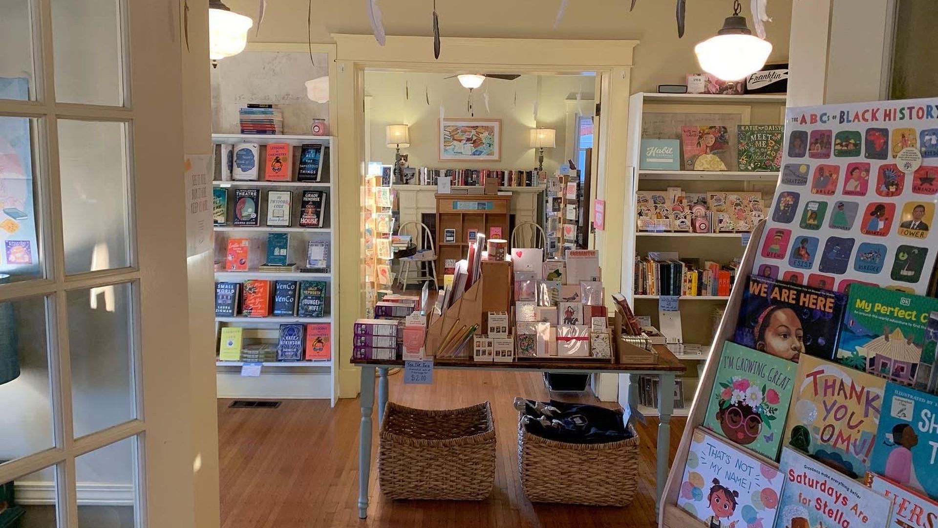 A photo of the interior of Wild Geese Bookshop, showing shelves and tables of books.