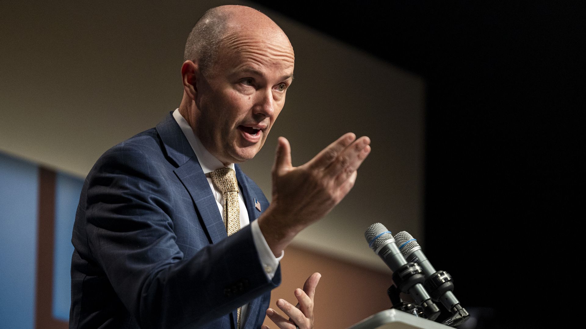 Utah. Gov. Spencer Cox speaks in front of mics.