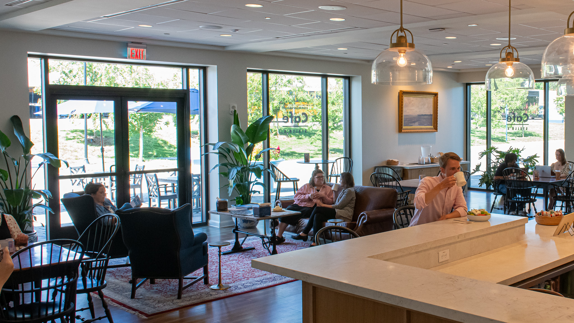 People sitting in a little cafe 