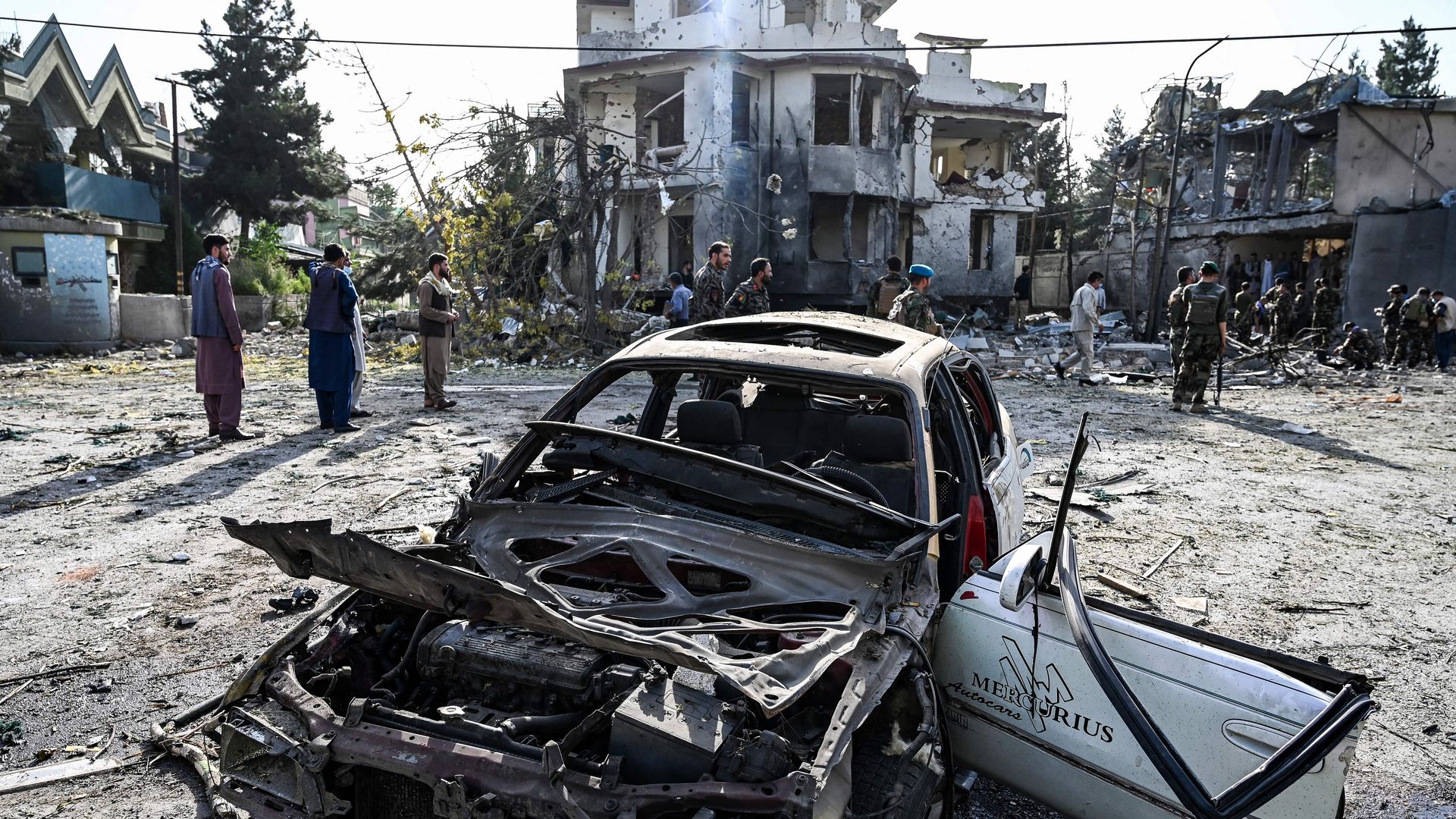 Photo of a car and home in tatters after an explosion