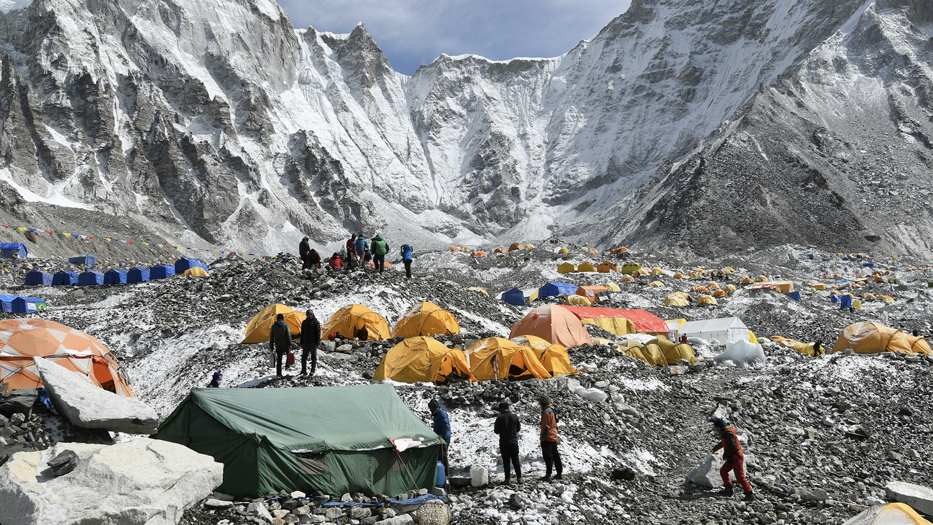 Yellow and greens tents are set up in Mount Everest's base camp.