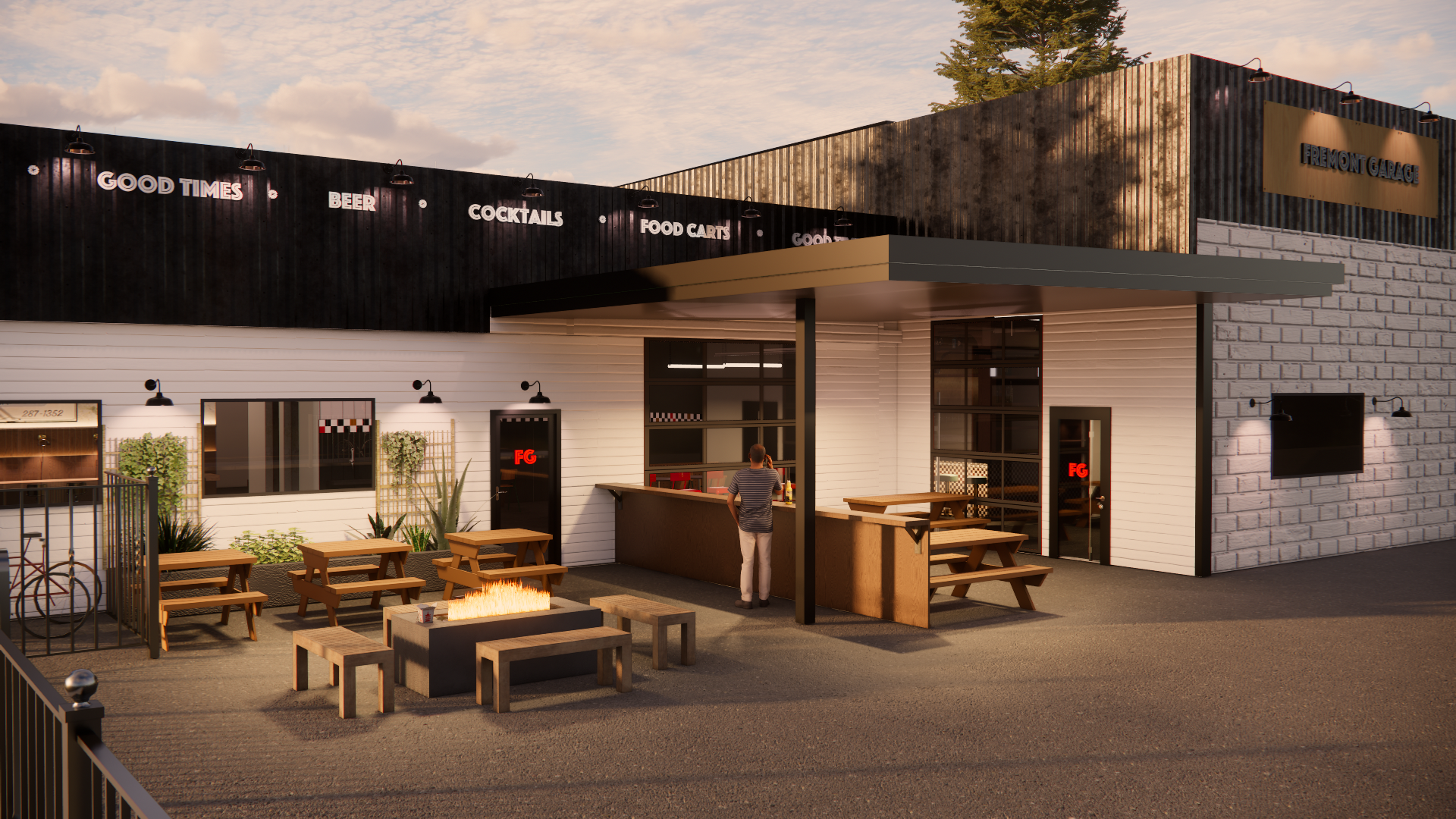Exterior of Fremont Garage at dusk: black sign wall, white siding, outdoor bar under a canopy, wooden picnic tables, and a man at the bar.
