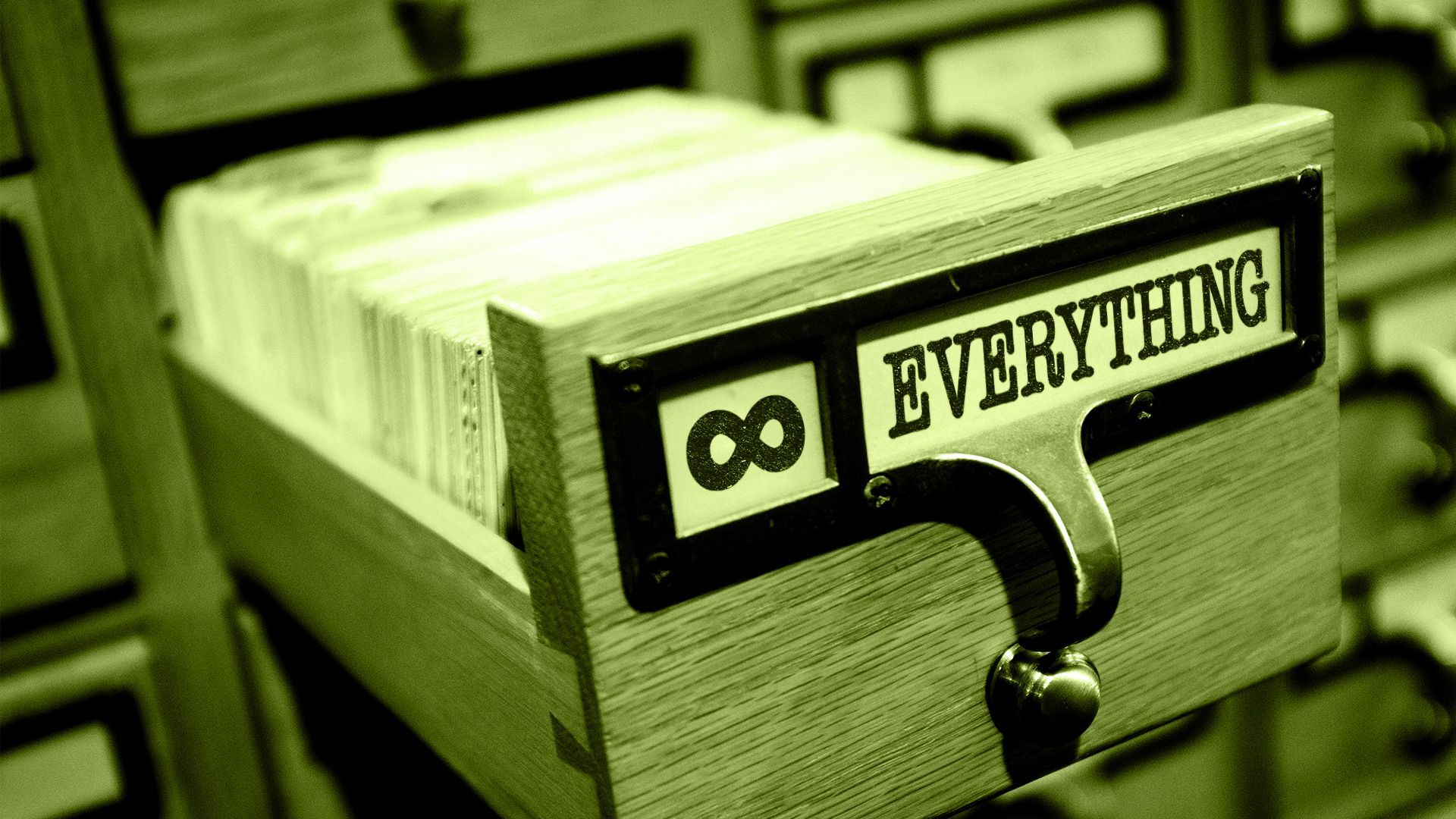 Illustration of a library card catalog draw labeled EVERYTHING, with an infinity symbol. 