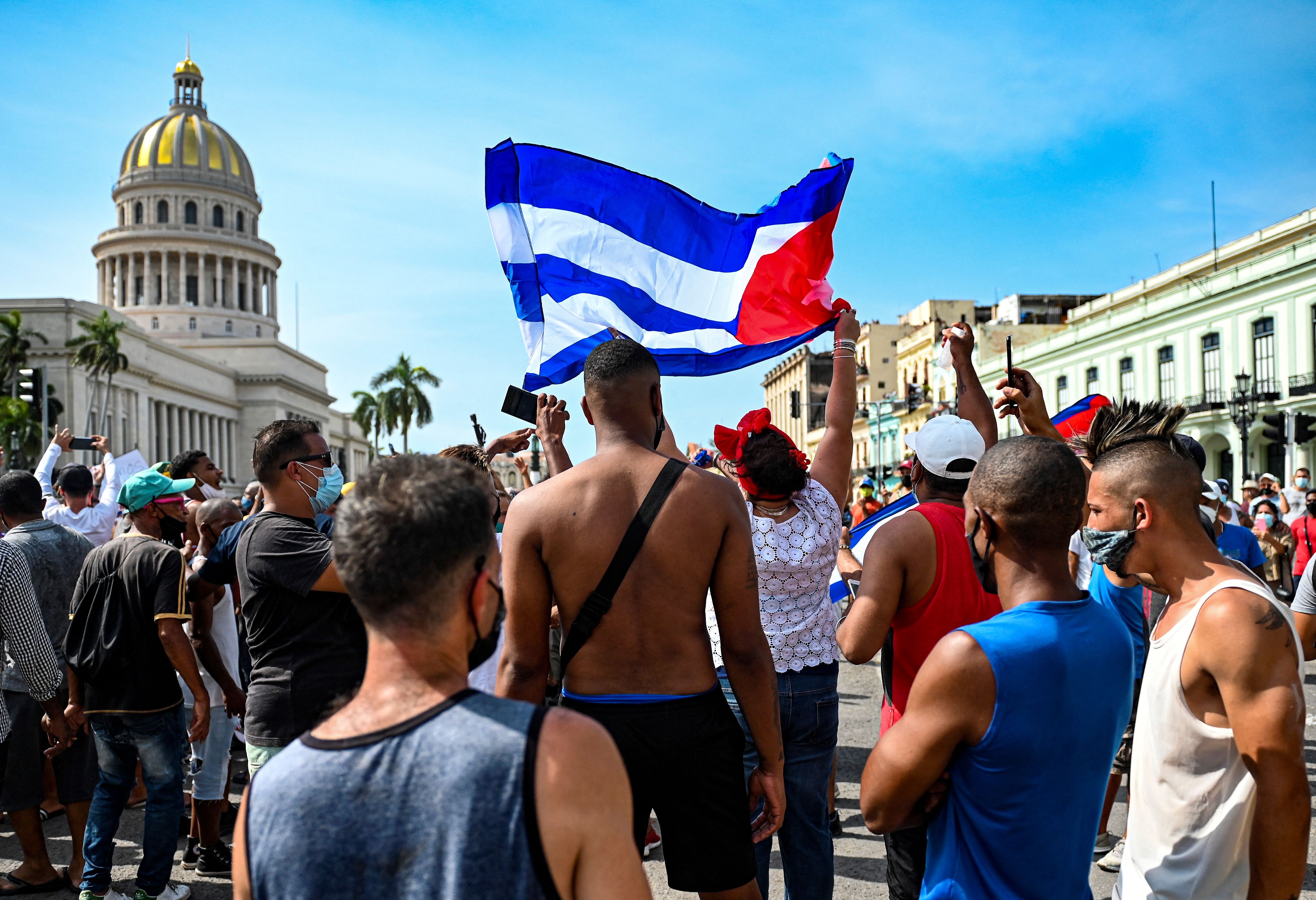 Cubans are seen outside Havana's Capitol during a demonstration against the government of Cuban President Miguel Diaz-Canel in Havana, on July 11