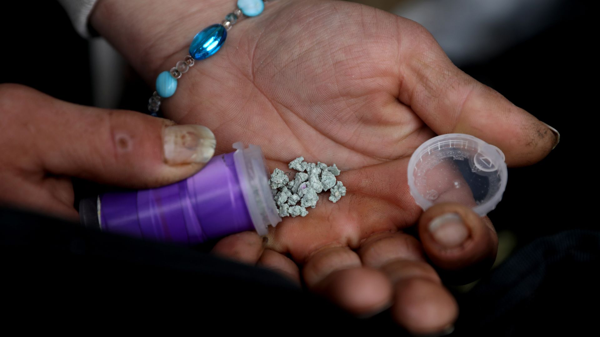 A hand holding fentanyl.
