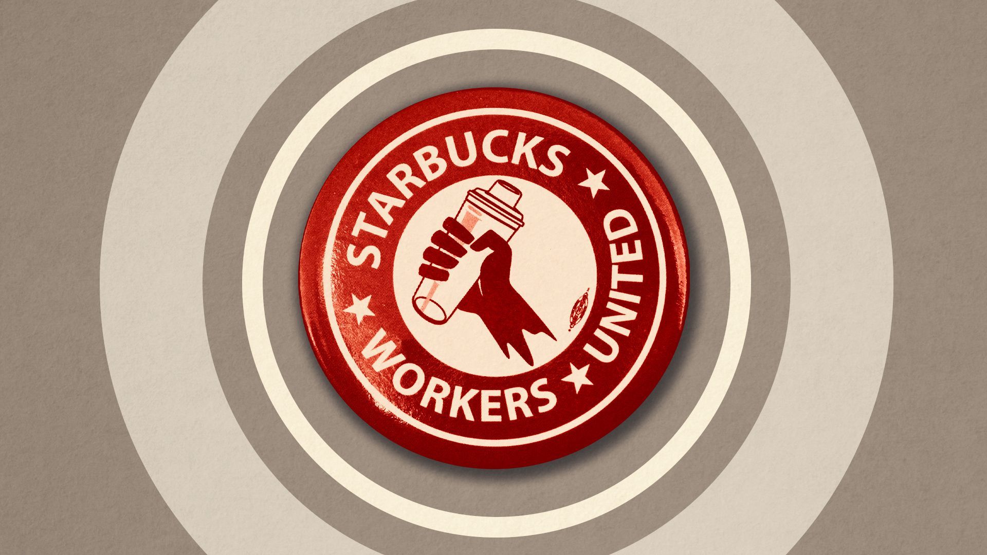 Photo illustration of a "Starbucks Workers Unite" button surrounded by abstract shapes.