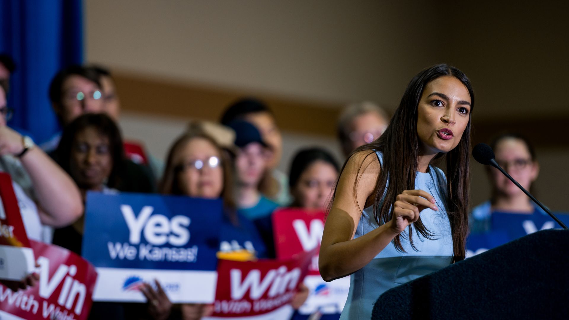 Alexandria Ocasio-Cortez speaking at a rally in Kansas