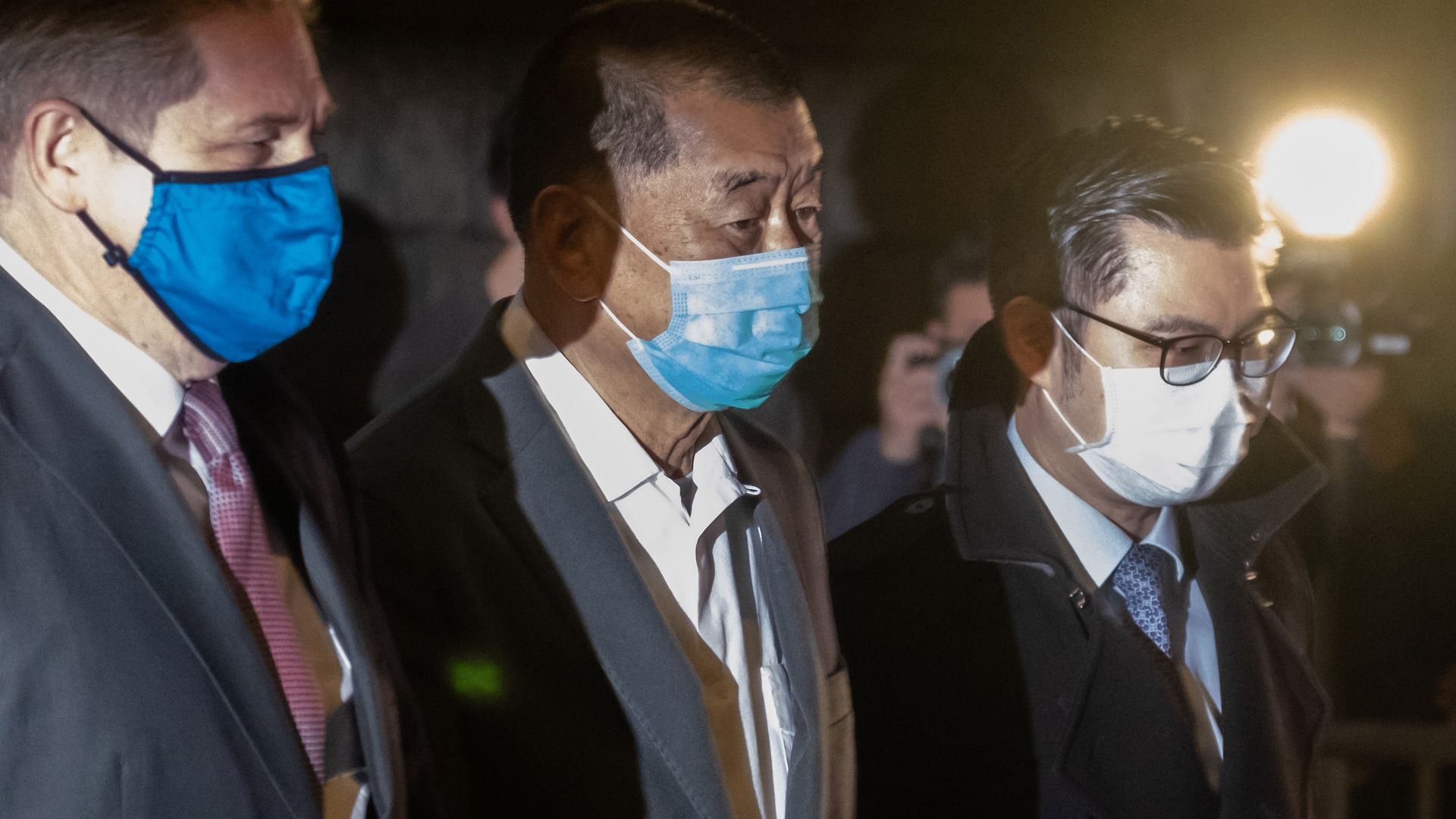 Jimmy Lai, founder and chairman of Next Digital Ltd., center, leaves the High Court.