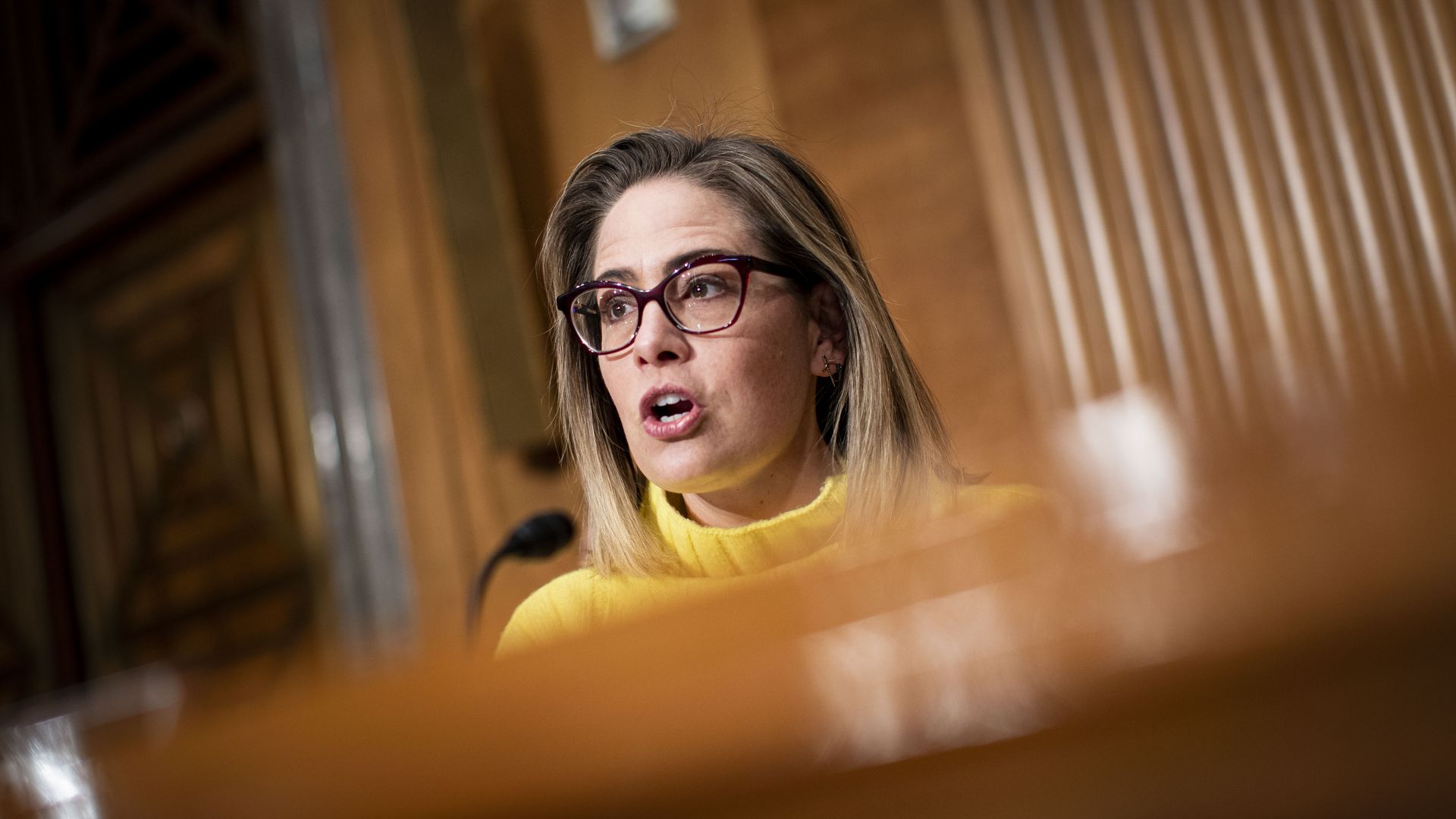 Sen. Kyrsten Sinema is seen speaking during a Senate hearing.