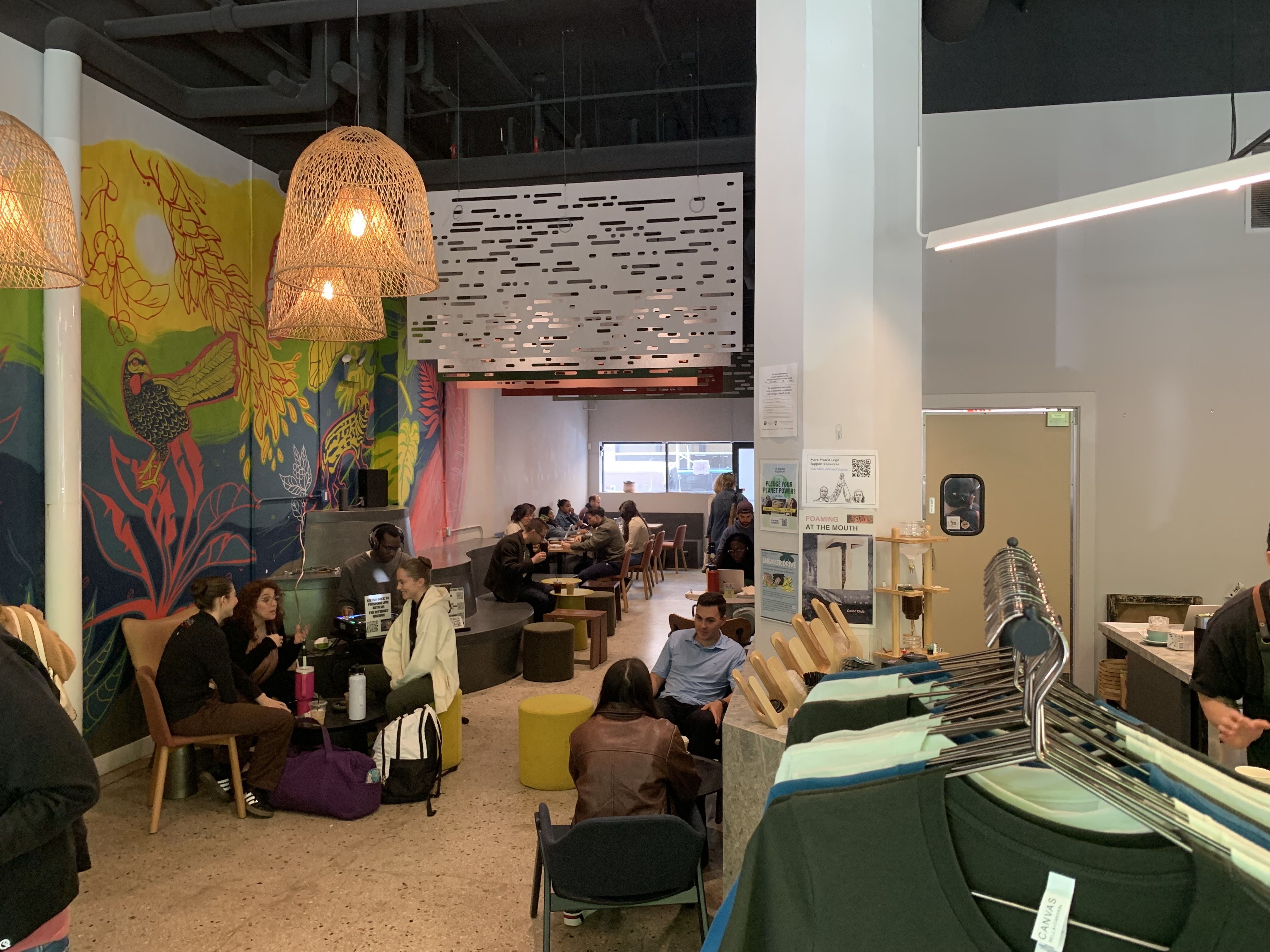 Photo of a coffee shop with cool art on the walls. 