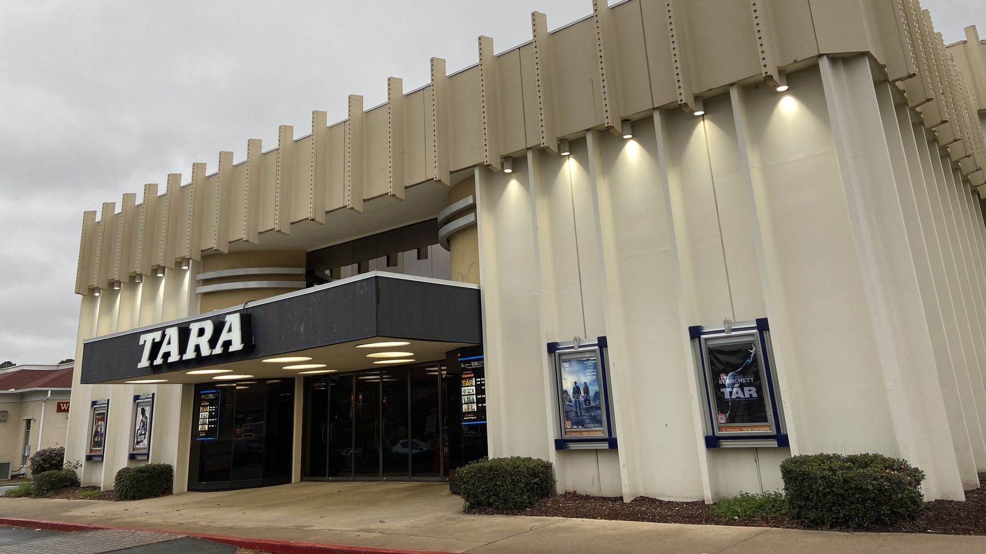 A boxy movie theater with the word “Tara” in big letters on the overhang
