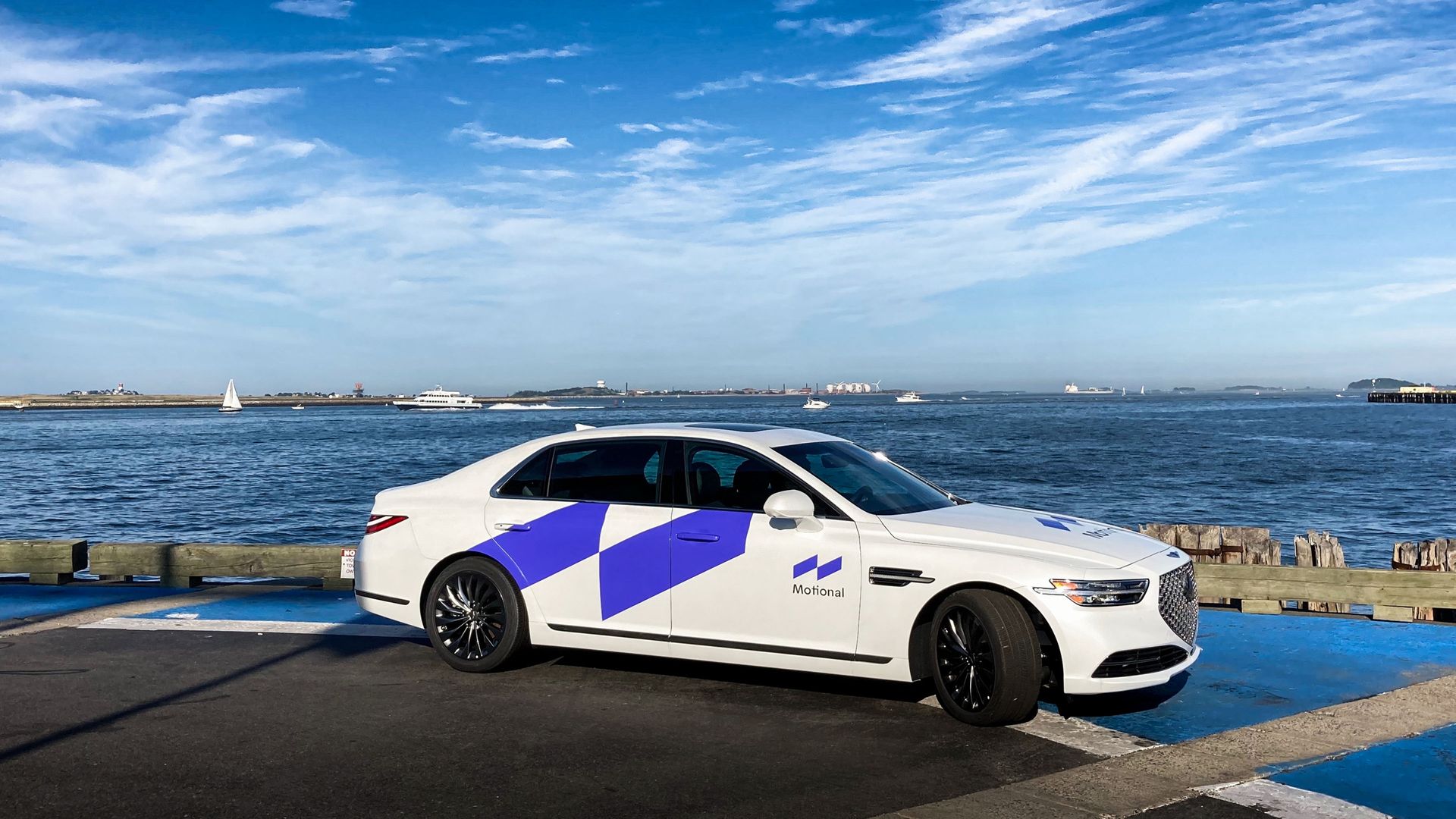 Image of a Hyundai Sonata with Motional self-driving logo on it, parked near the ocean.