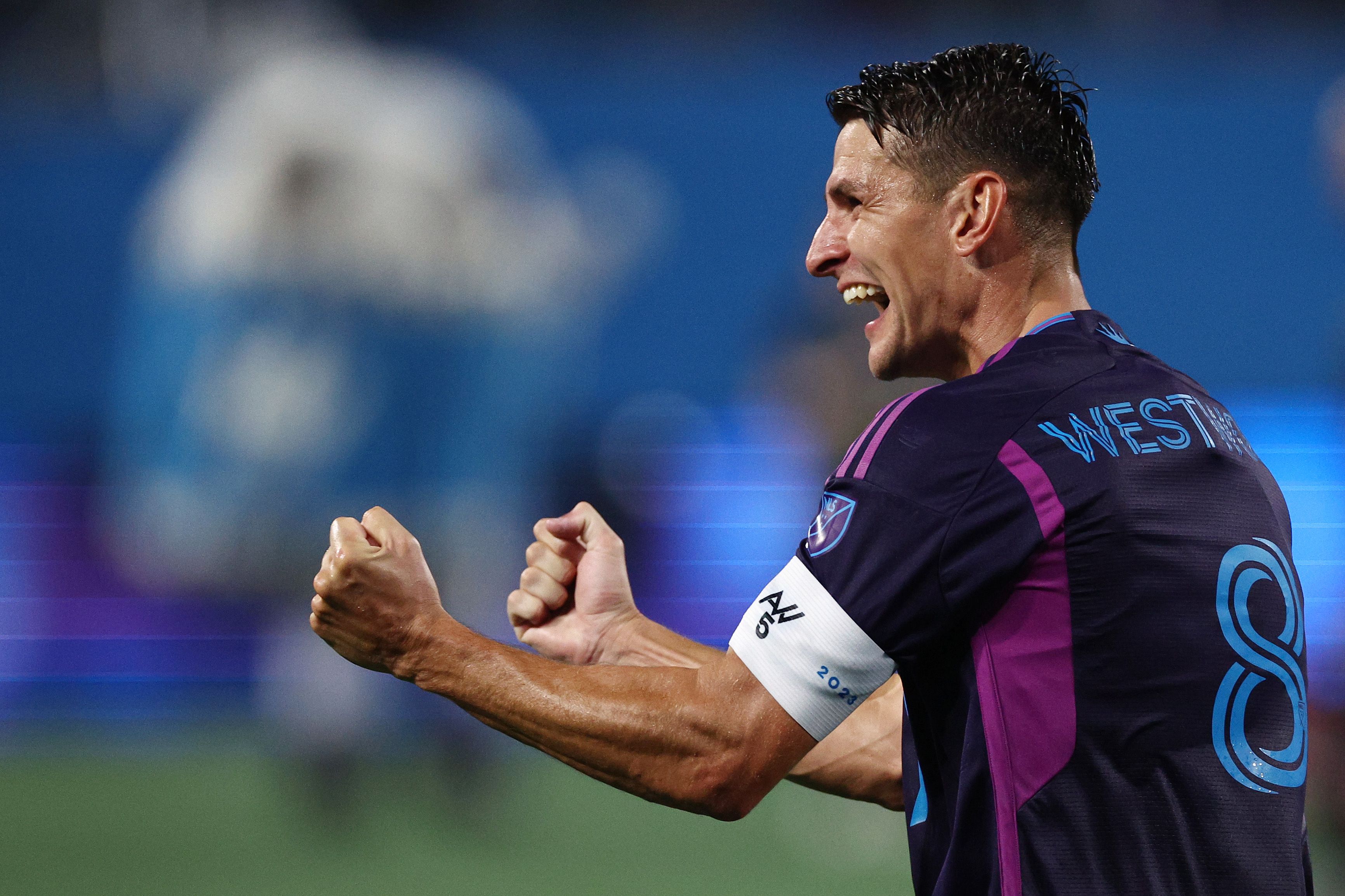 Ashley Westwood celebrates.