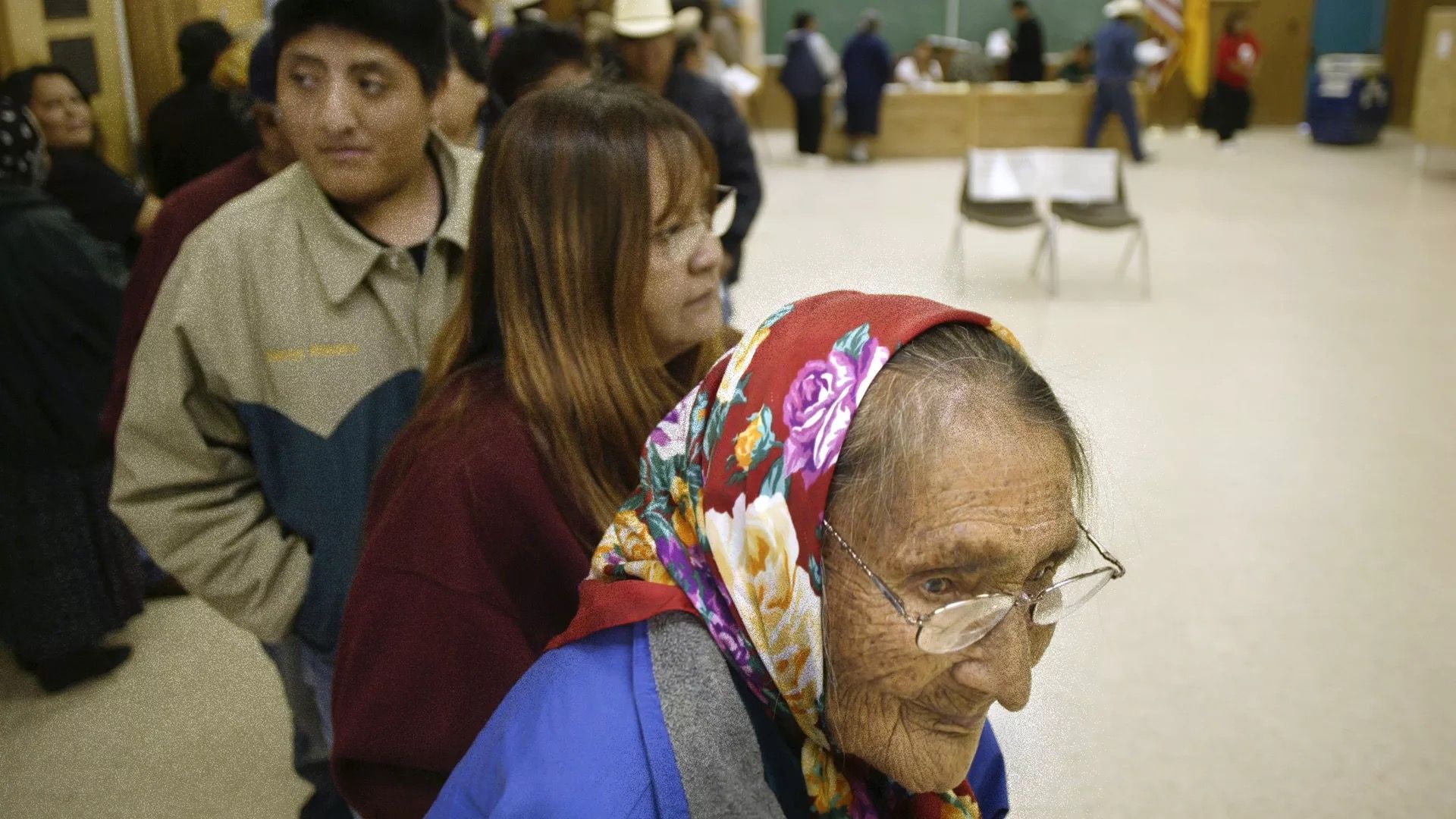 Native American voters are seen lining up to cast ballots.