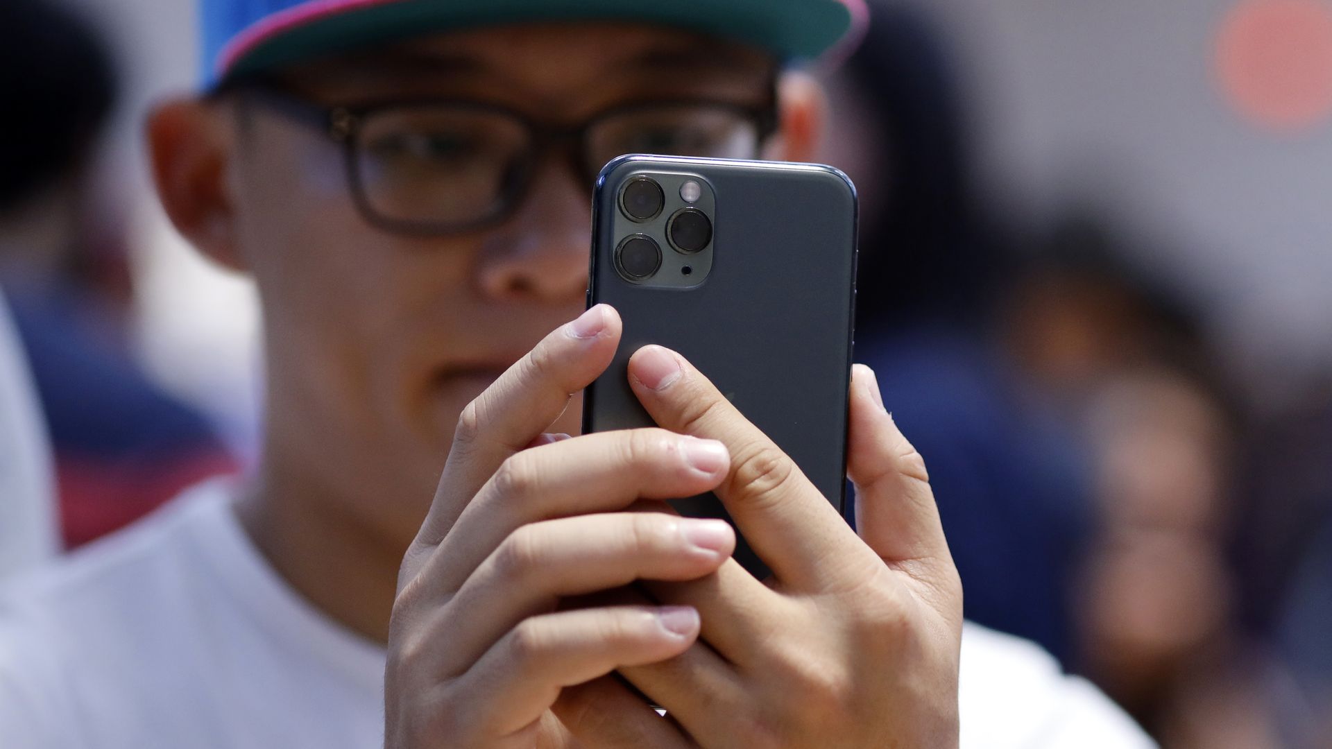 A customer tries an iPhone 11 Pro Max.