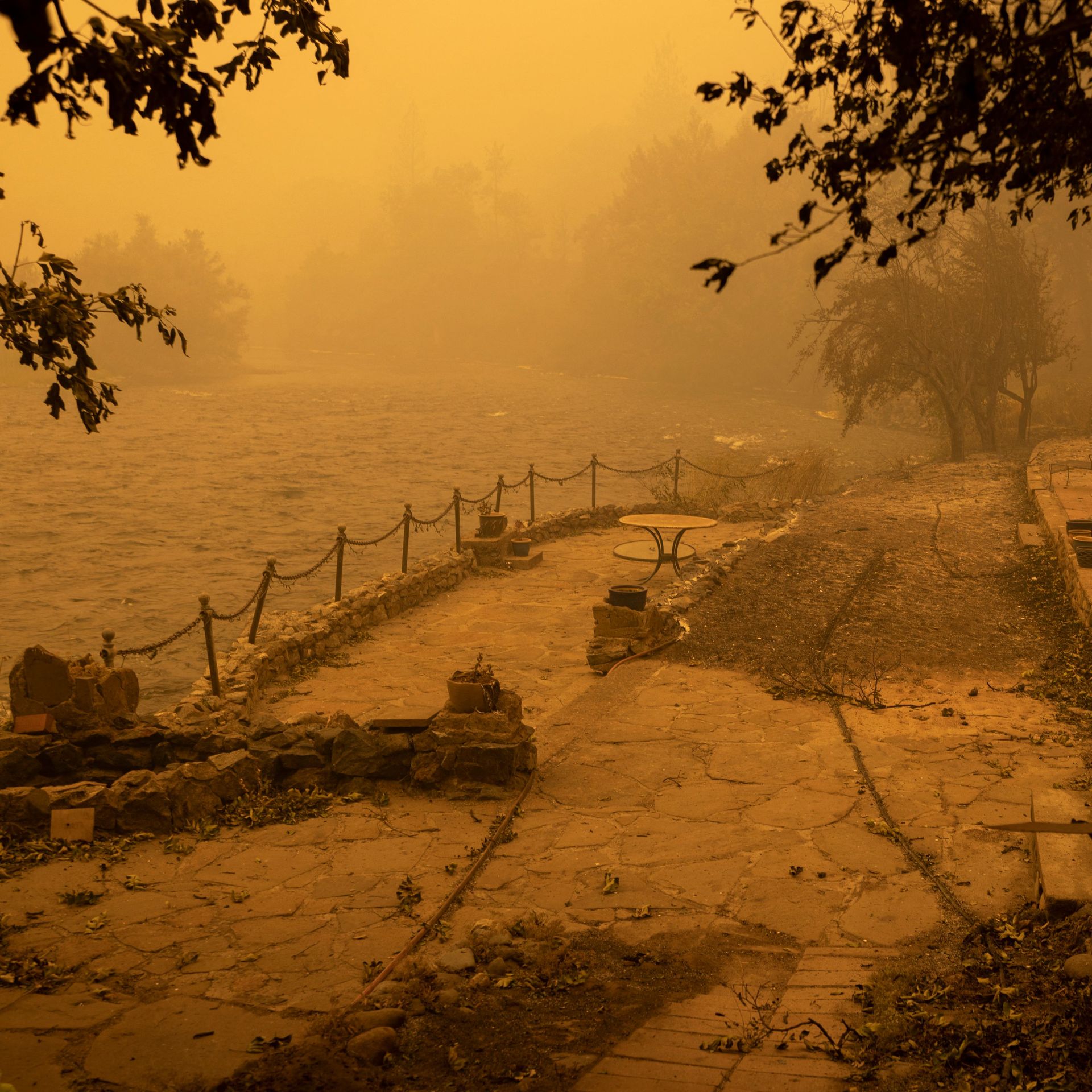 River-front property in the community of Klamath River lies in ruins after it burned in the McKinney Fire in the Klamath National Forest, northwest of Yreka, California, on July 31, 2022.