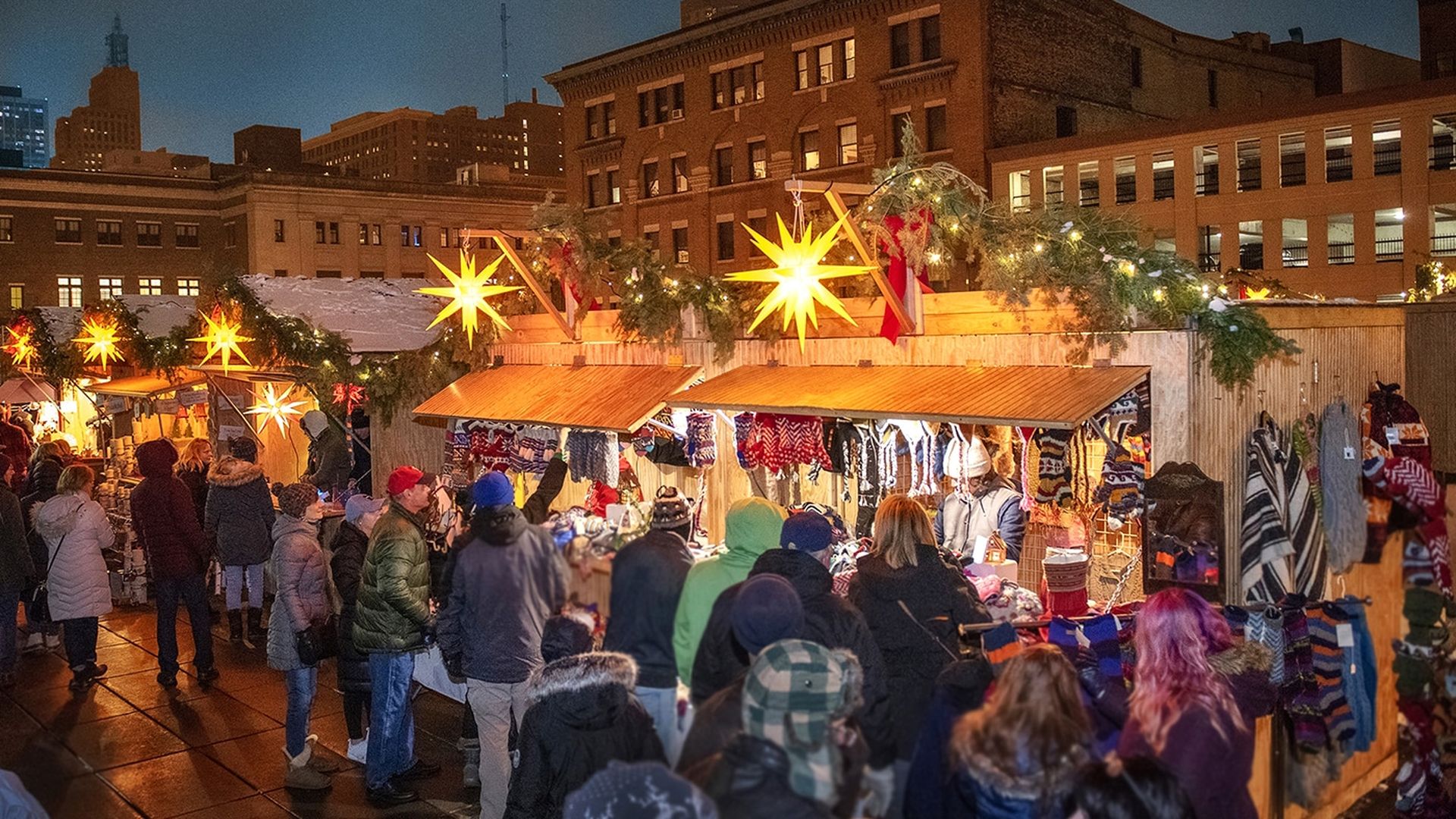 large crowd outdoors at market during nighttime 