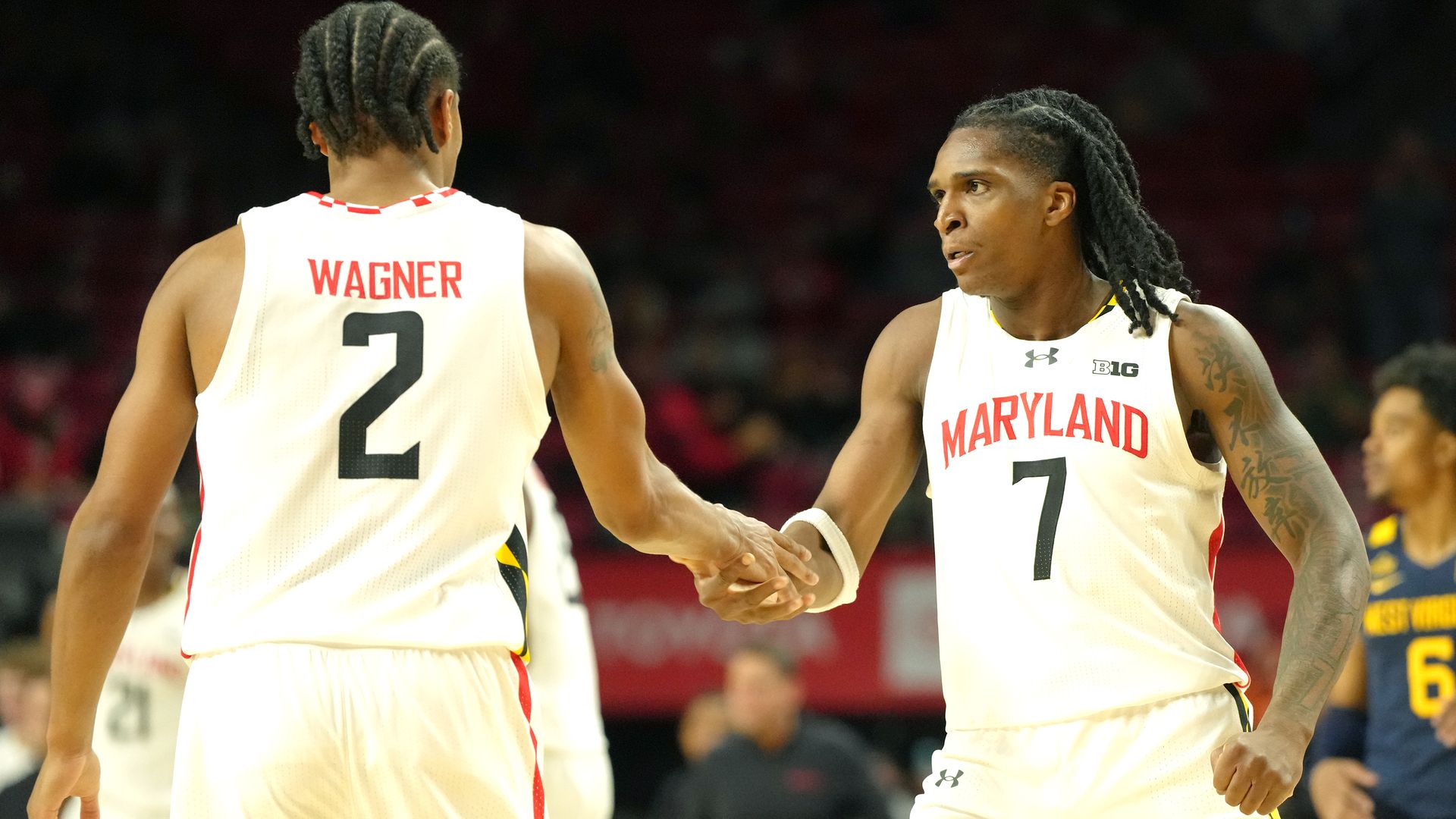 DJ Wagner #2 and Andre Mills #7 of the Maryland Terrapins celebrate a shot during a college basketball exhibition game against the West Virginia Mountaineers at the Xfinity Center on October 18, 2026 in College Park, Maryland. (Photo by Mitchell Layton/Getty Images)