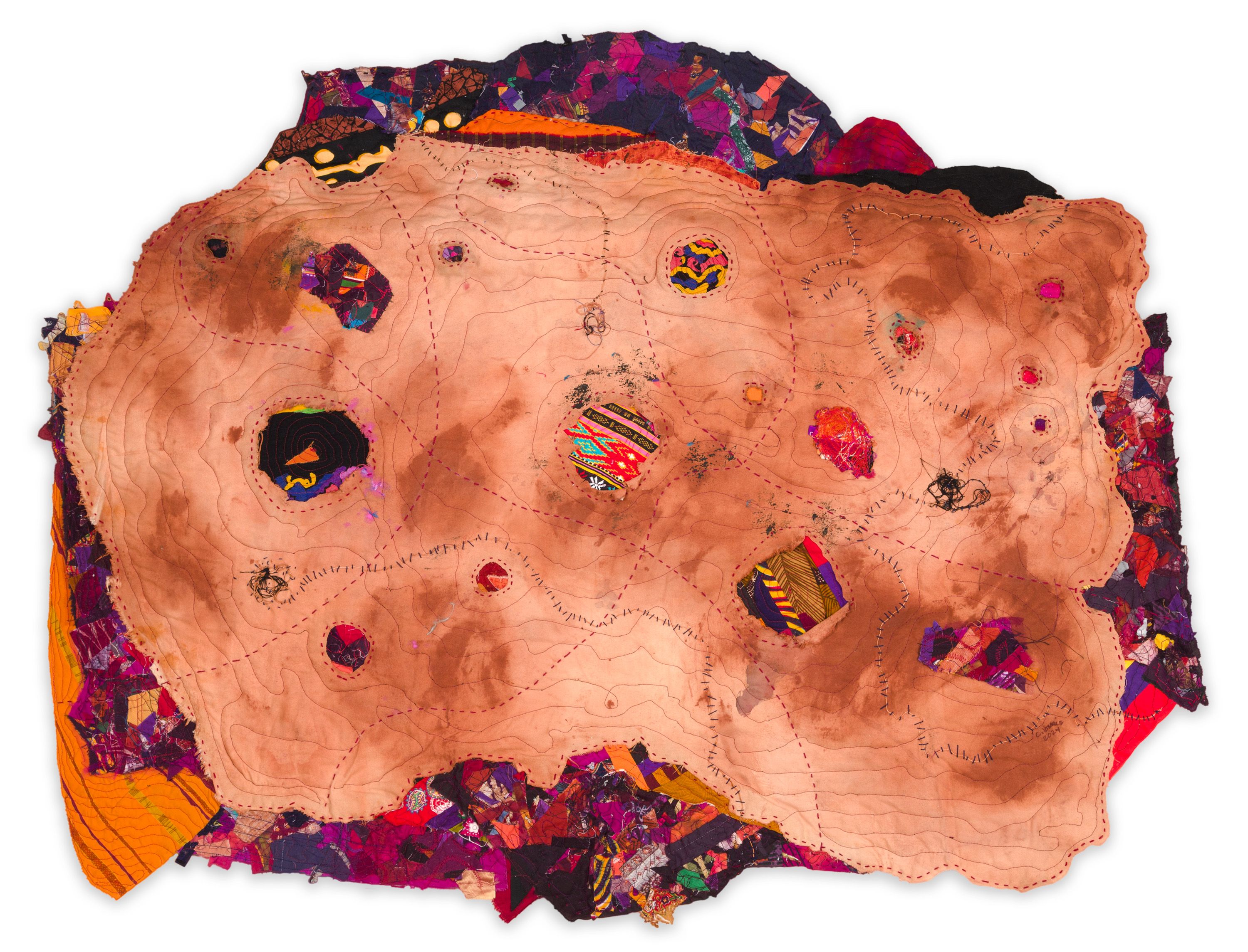 A piece of fabric art that almost looks like a map, with various lines winding around a canvas.