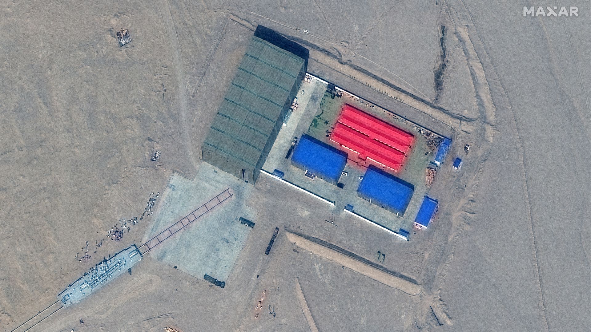 Images show a rail system with a ship-sized target mounted on it.