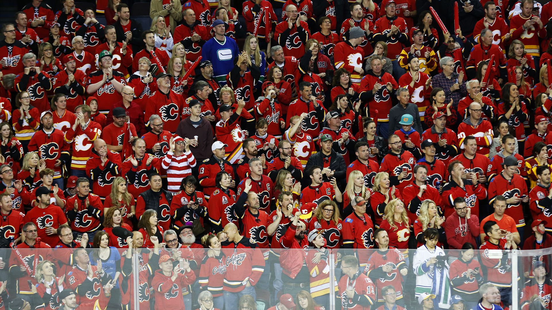 Waldo among a sea of hockey fans dressed in red jerseys