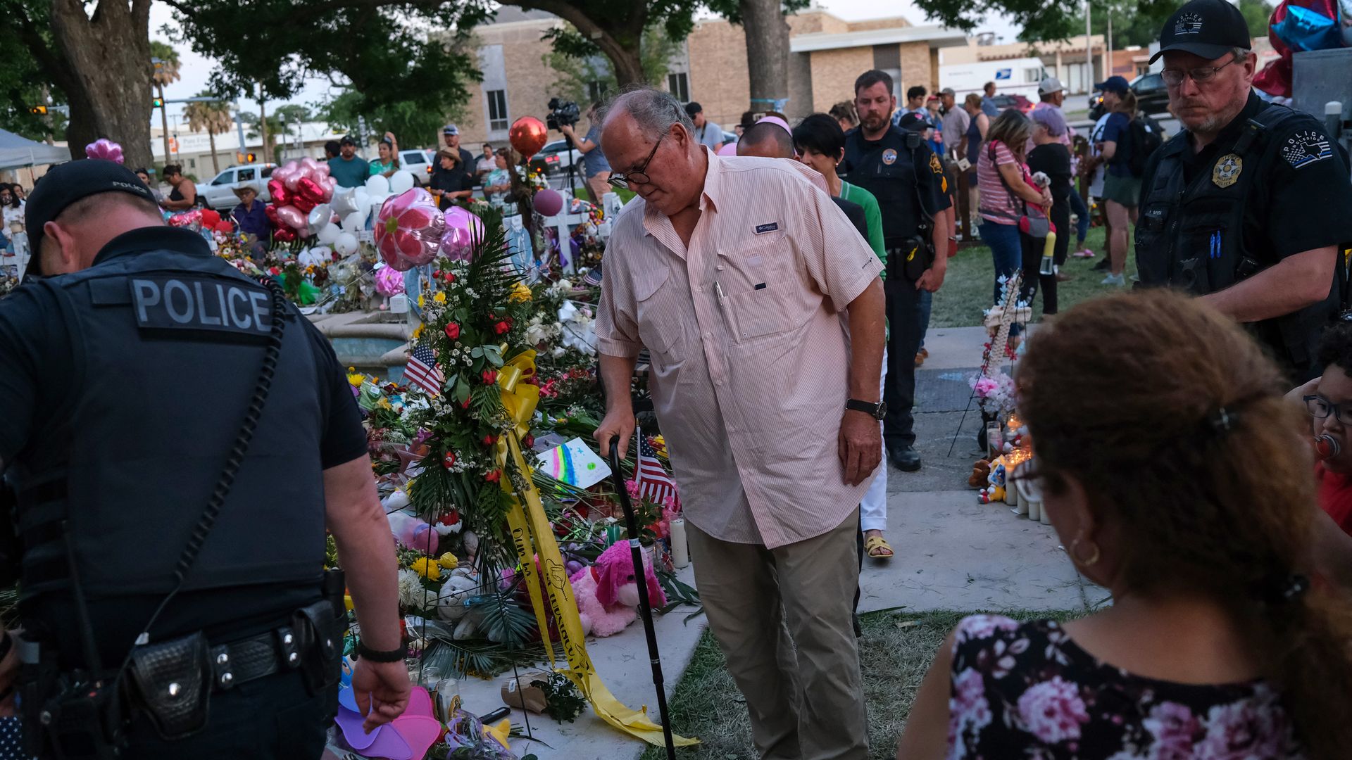 Uvalde Mayor Don McLaughlin (center with walking cane) visits the memorial for the Robb Elementary School students and teachers at the City of Uvalde Town Square on May 29, 2022 in Uvalde, Texas. 