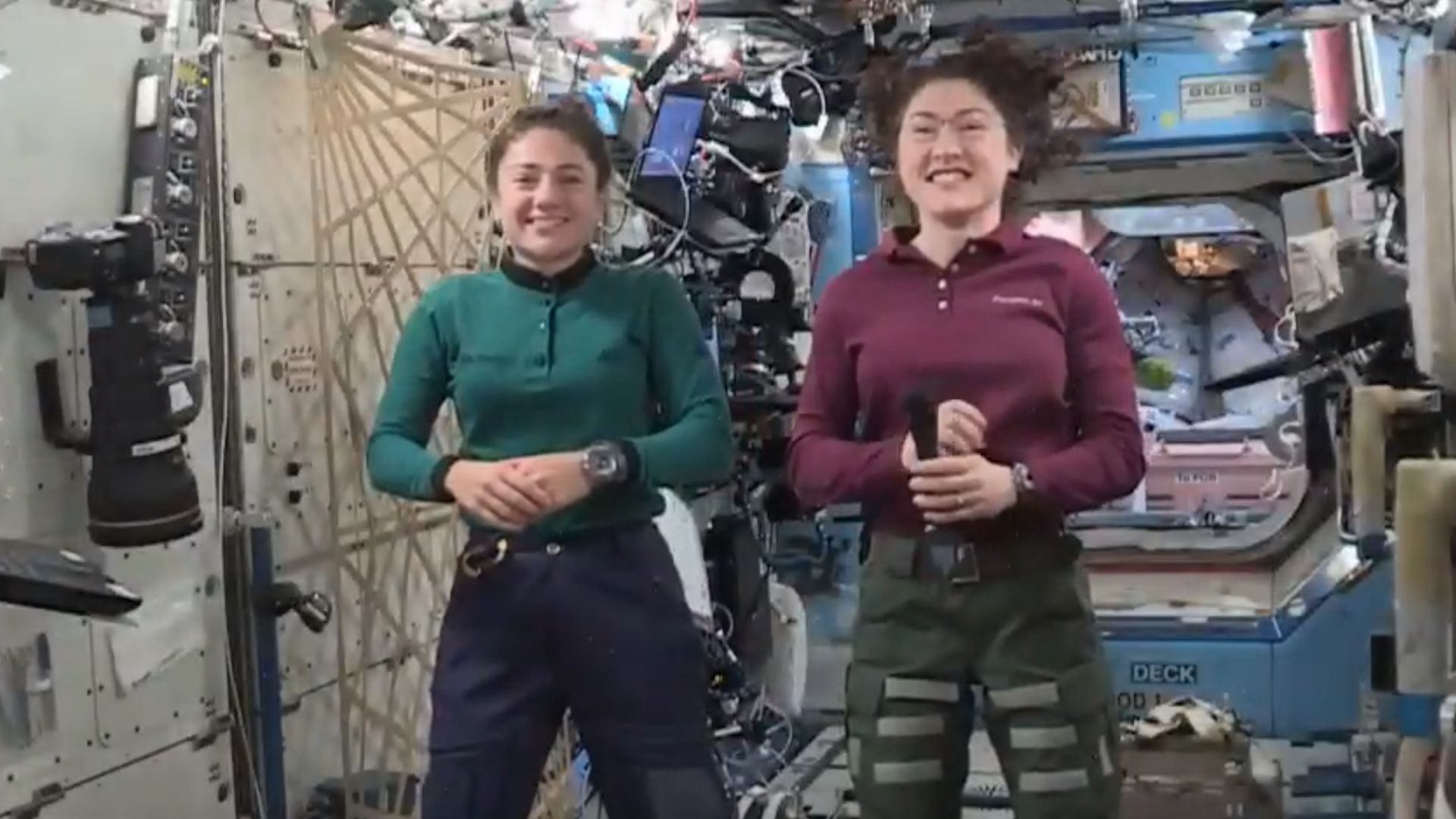 Two astronauts floating on the International Space Station