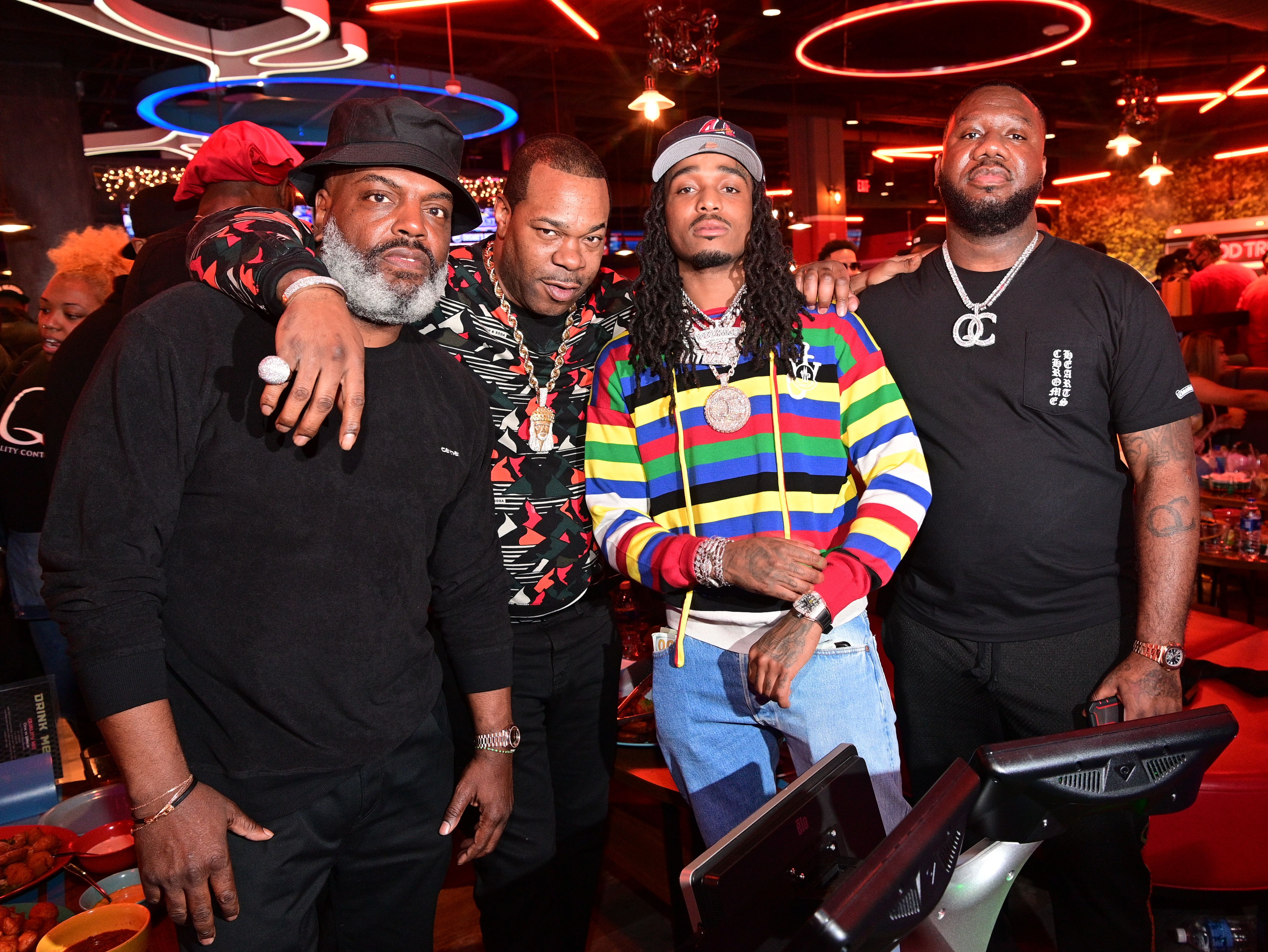 Kevin "Coach K" Lee poses at a stylish bowling alley with Busta Rhymes, Quavo and Pierre "Pee" Thomas