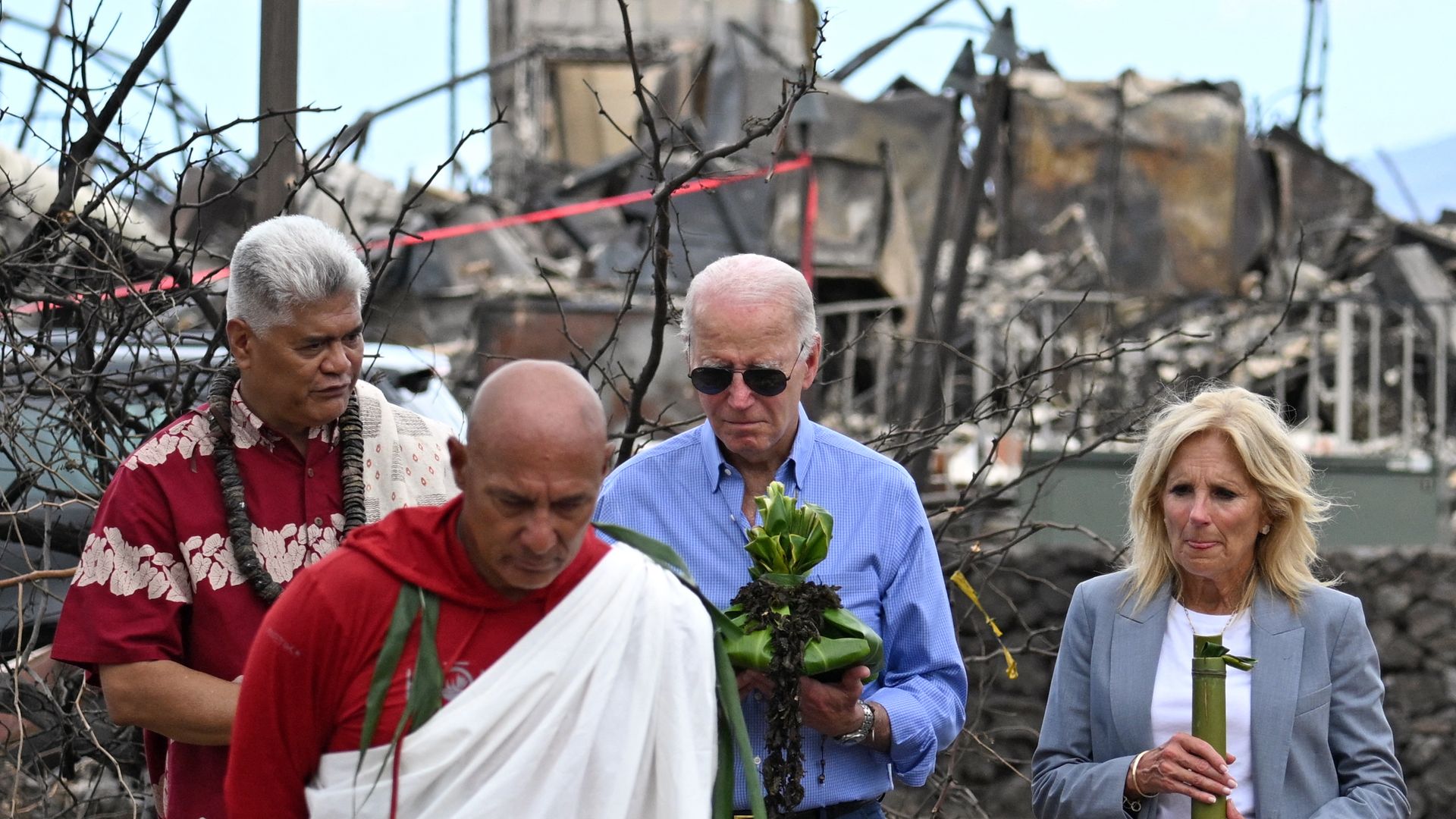 President Joe Biden and US First Lady Jill Biden participate in a blessing ceremony with the Lahaina elders at Moku'ula following wildfires in Lahaina, Hawaii on August 21, 2023. The Bidens are expected to meet with first responders, survivors, and local officials following deadly wildfires in Maui.